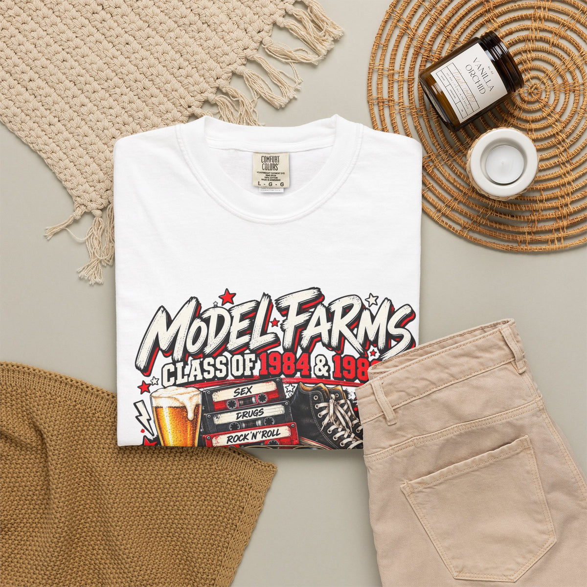 White crewneck T-shirt with front retro “Model Farms” class graphic and beer mug artwork