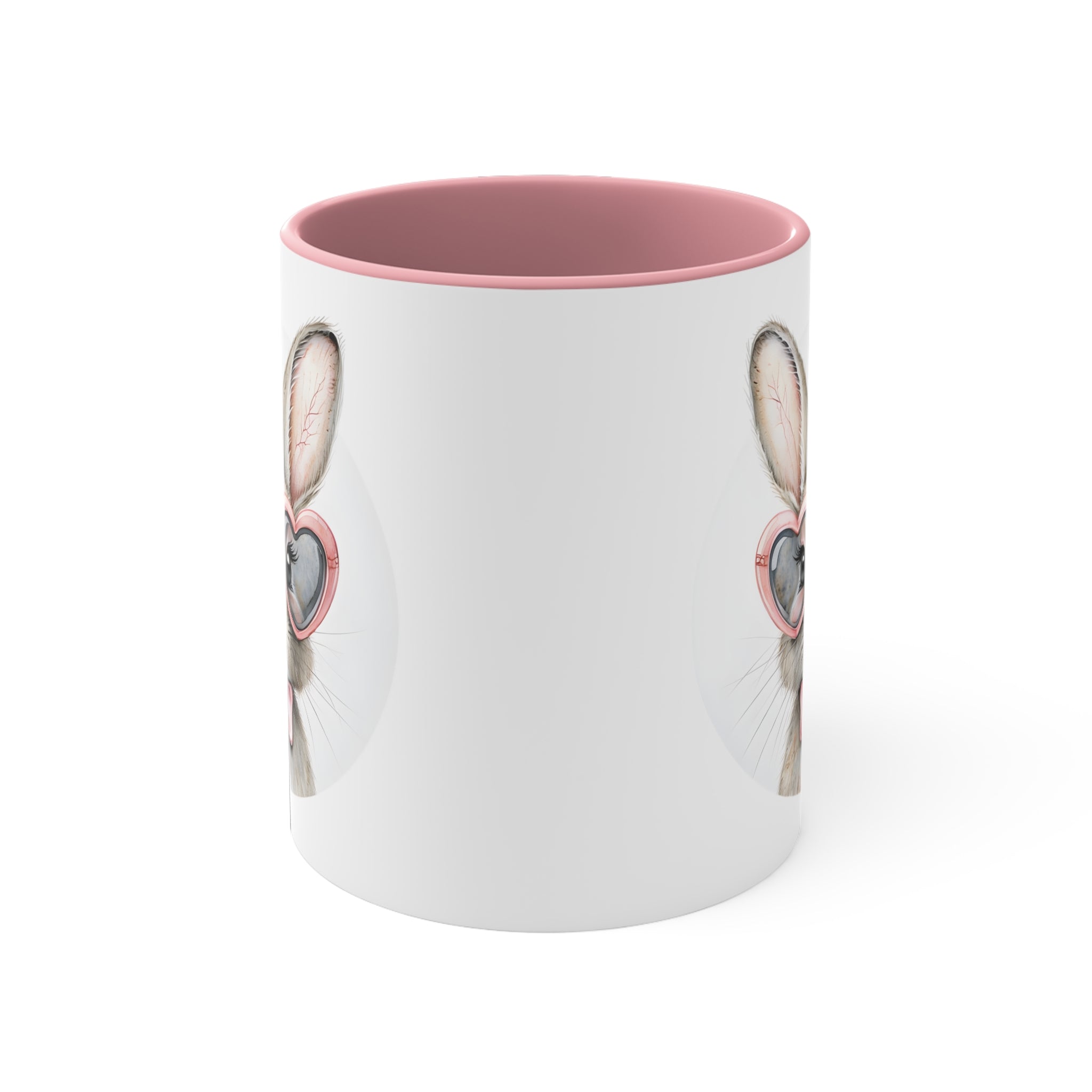 White ceramic mug with pink rim; side view shows bunny ears and glasses design