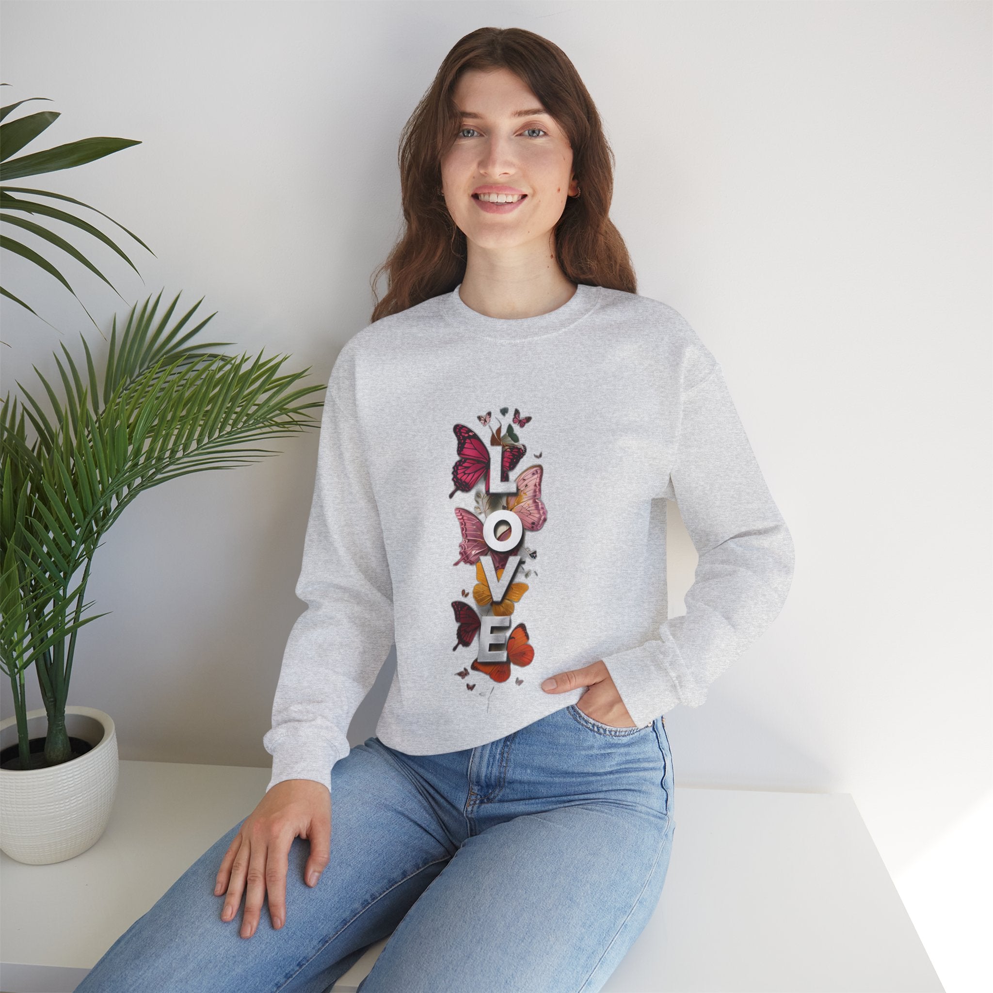 Ash gray sweatshirt with long sleeves and LOVE word butterfly graphic on front
