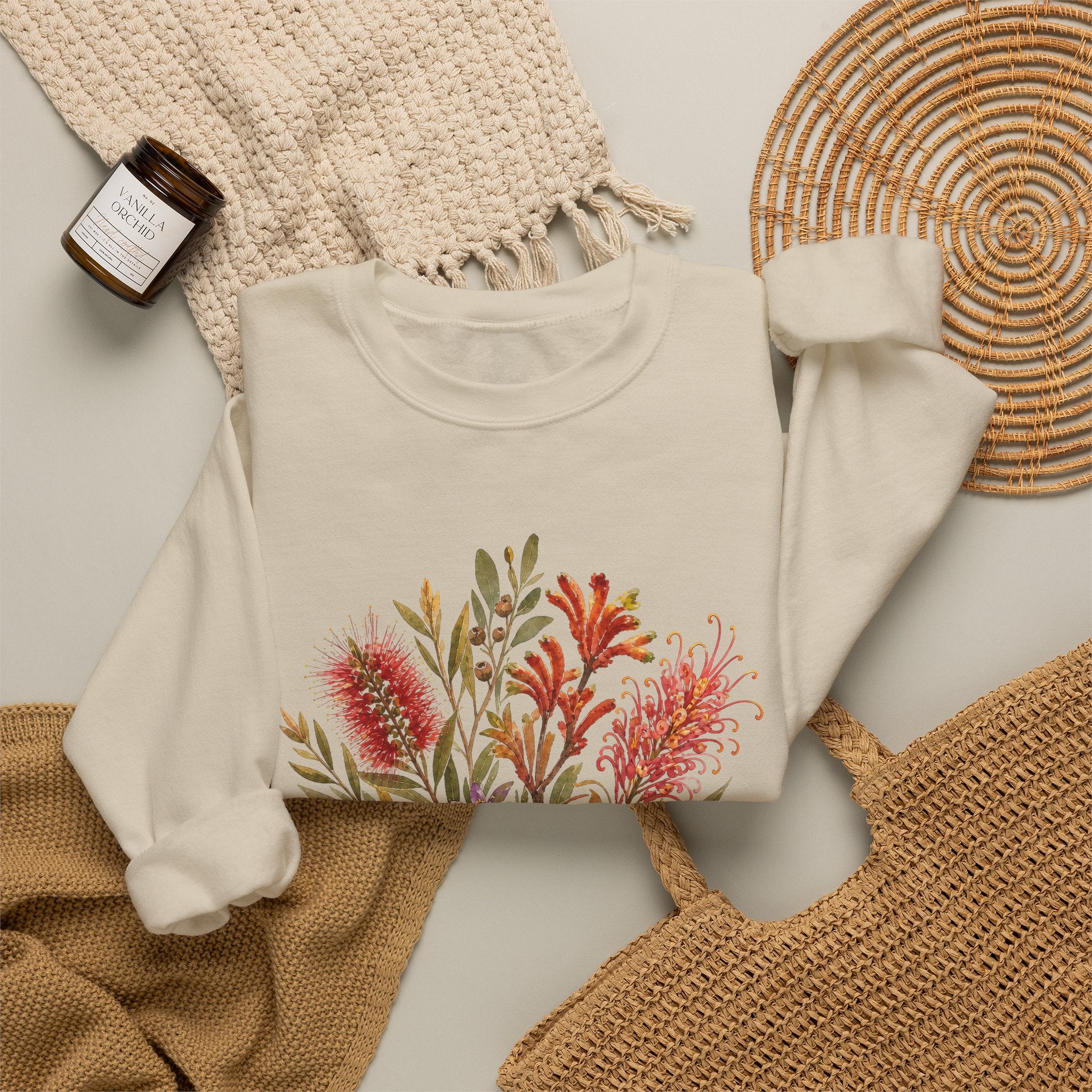 Cream crewneck sweatshirt with colorful floral bouquet graphic on the front.