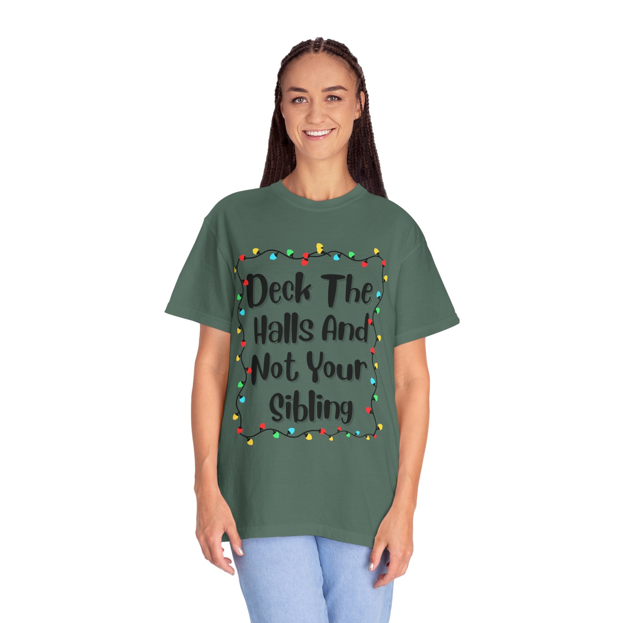 Sage green T-shirt with 'Deck The Halls And Not Your Sibling' light garland graphic