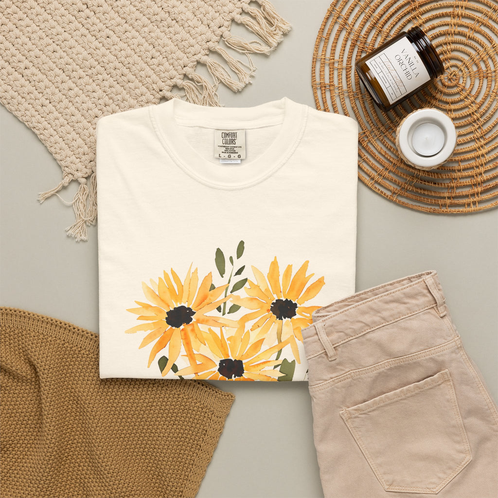 Ivory-white crew-neck T-shirt with orange sunflower bouquet print and green leaves
