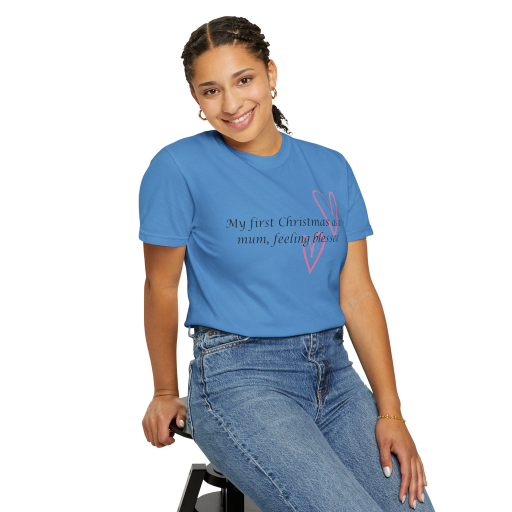 Blue crewneck T-shirt with pink heart outline and holiday slogan printed on chest.