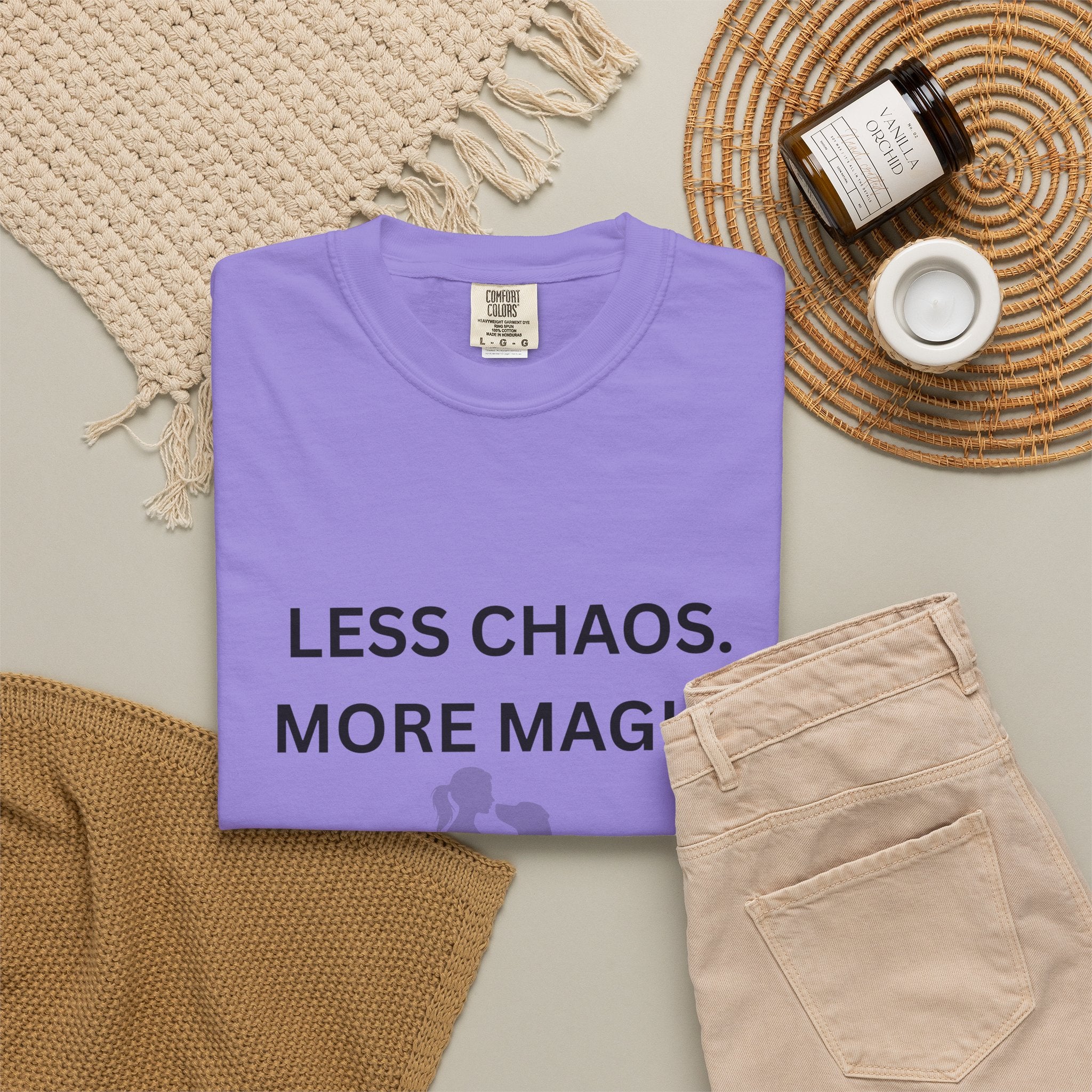 Purple crew-neck T-shirt with 'LESS CHAOS. MORE MAG' text and woman-dog silhouette graphic