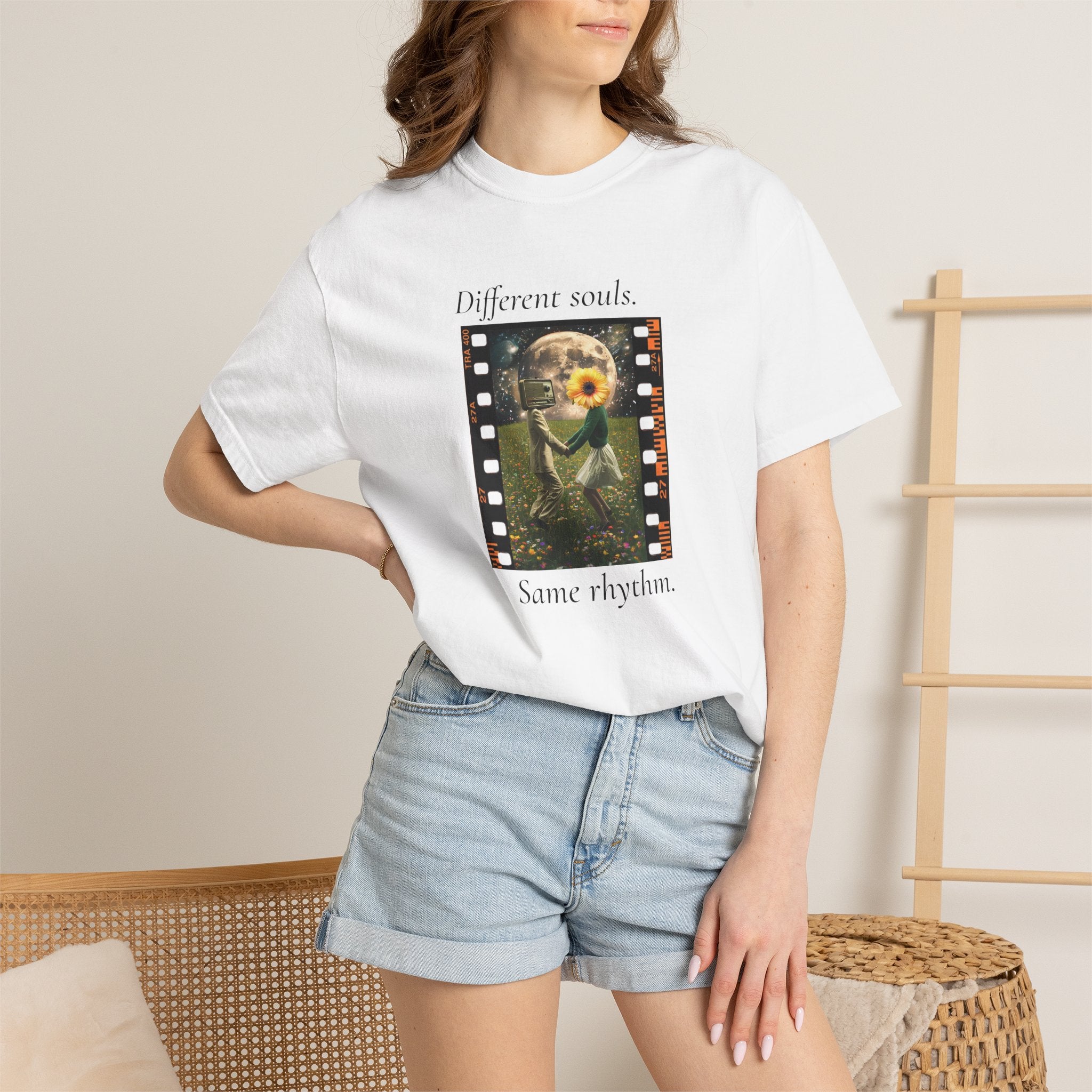 White T-shirt on model, featuring sunflower filmstrip graphic with “Different souls” and “Same rhythm”.