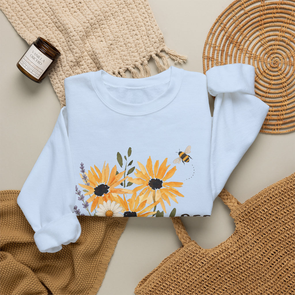 Light blue crewneck sweatshirt with sunflower bouquet print and bee details on front