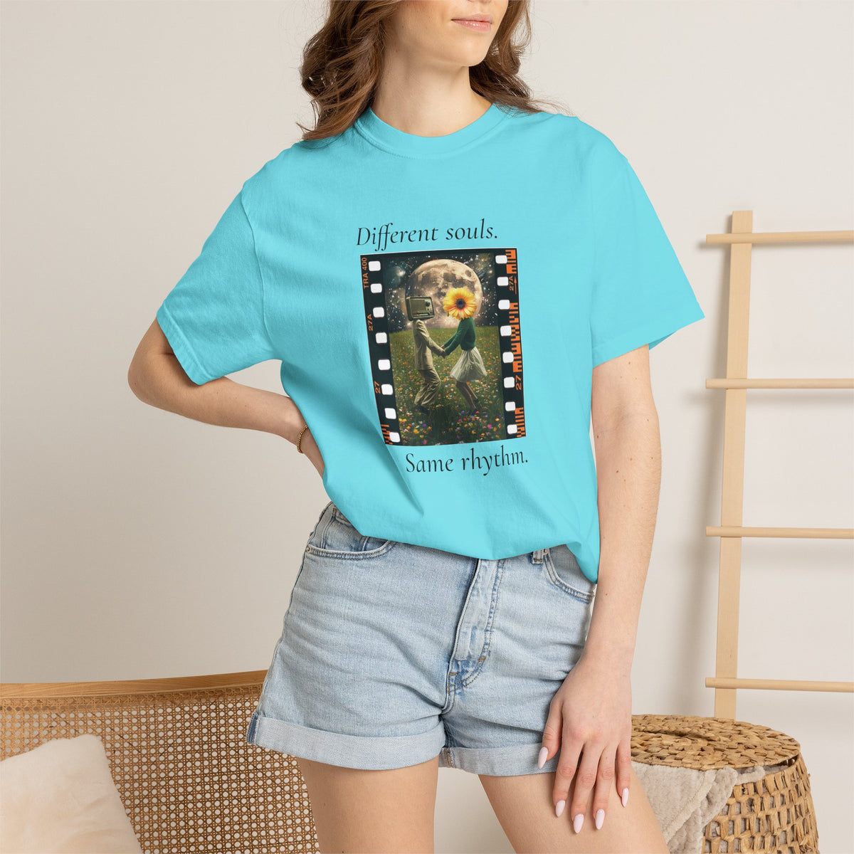 Turquoise crewneck tee with filmstrip sunflower graphic and text