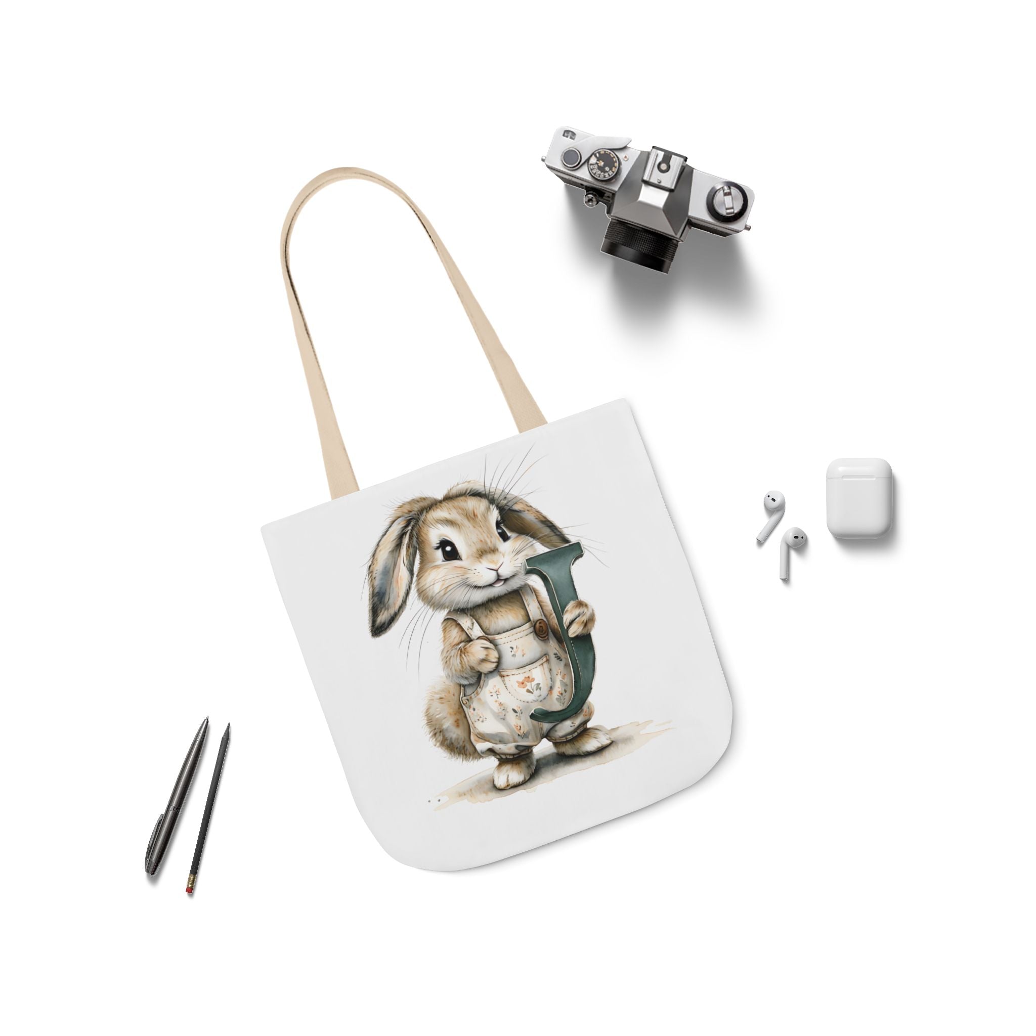 White canvas tote bag with bunny graphic and beige shoulder strap