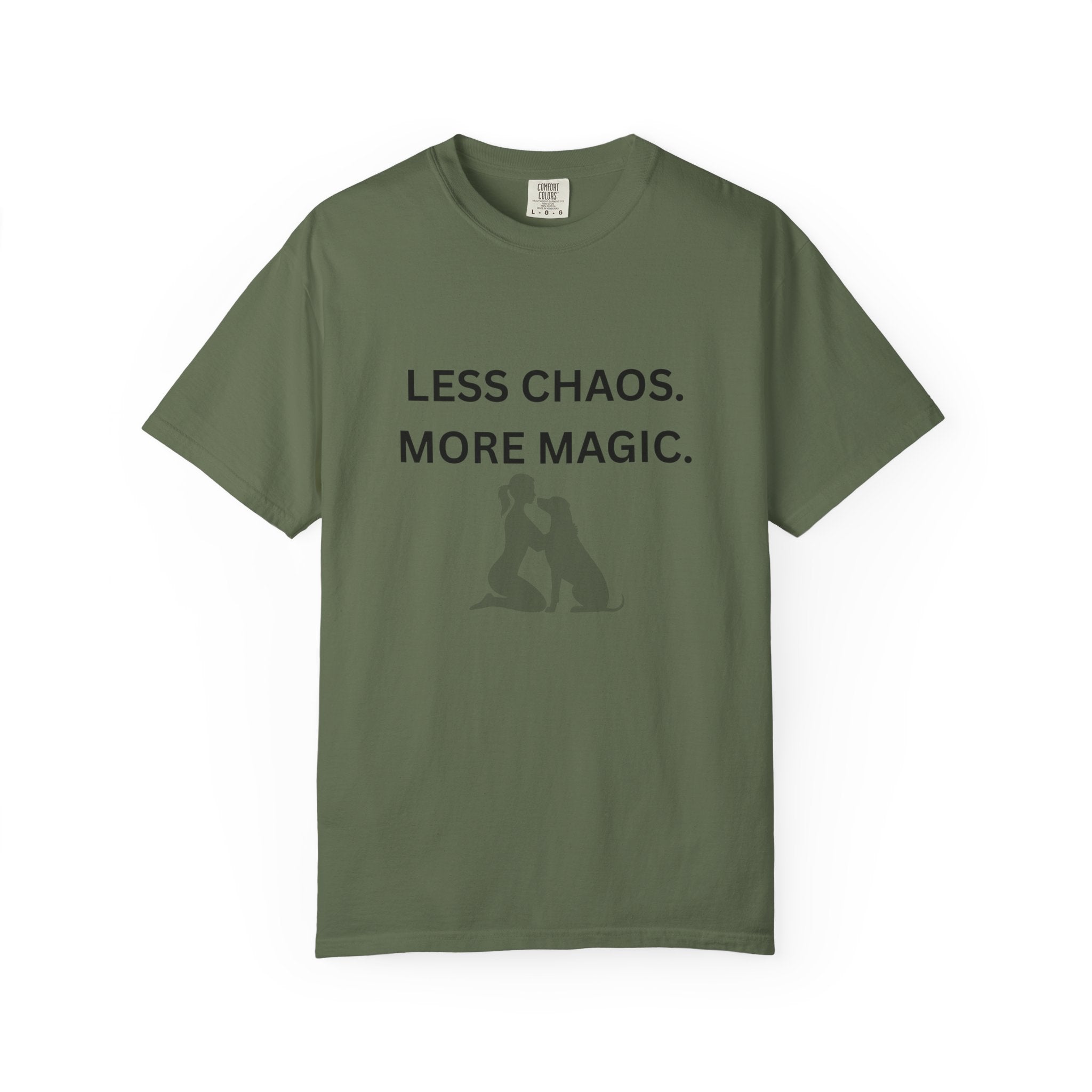 Green crew-neck T-shirt with 'LESS CHAOS. MORE MAGIC.' text and woman-dog silhouette