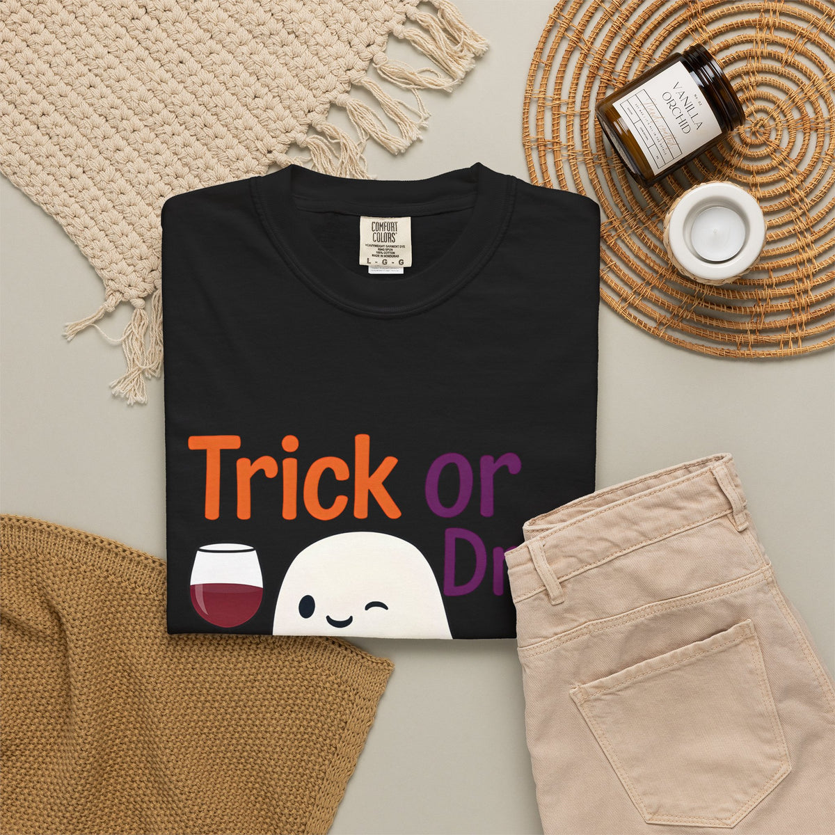 Black Halloween T-shirt with ghost face, wine glass, pumpkin, and "Trick or Drink" text