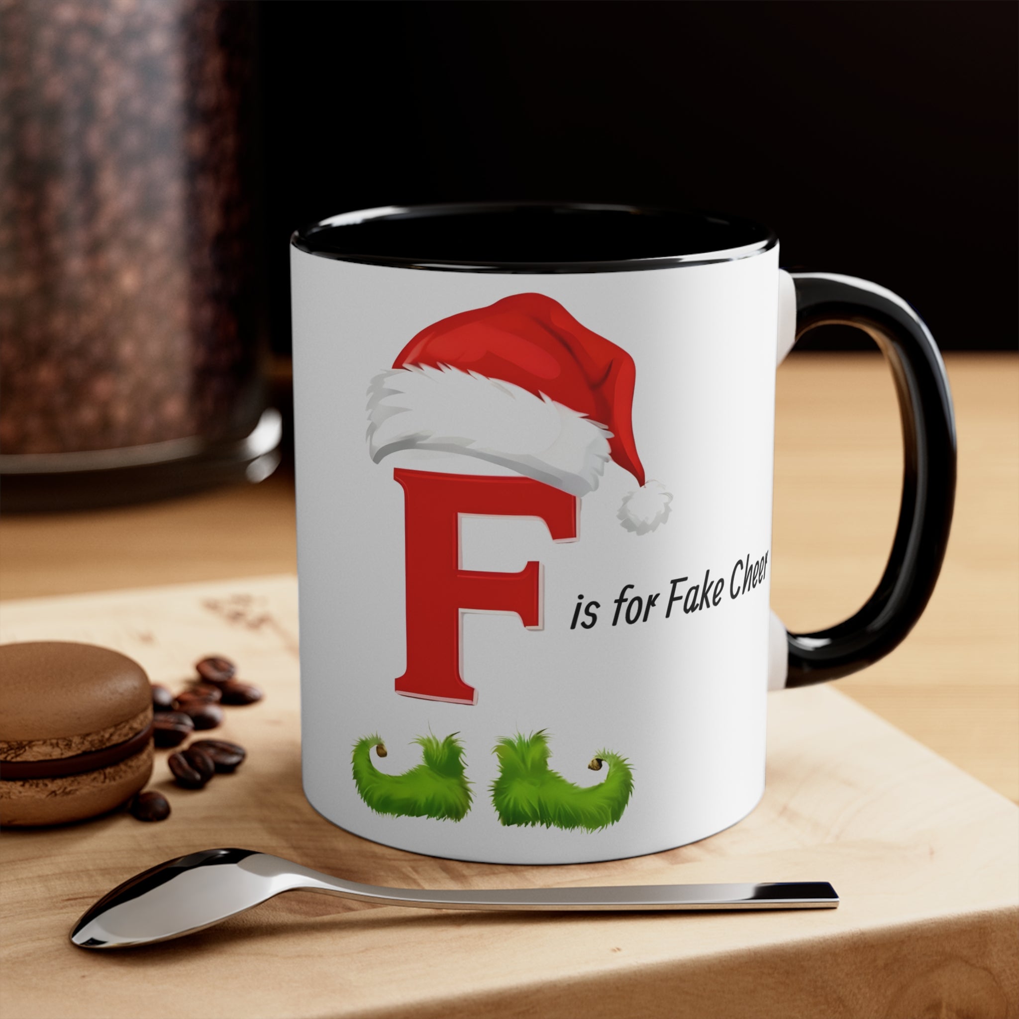 Christmas letter F mug, white with black rim and handle; Santa-hat F and “is for Fake Cheer” text