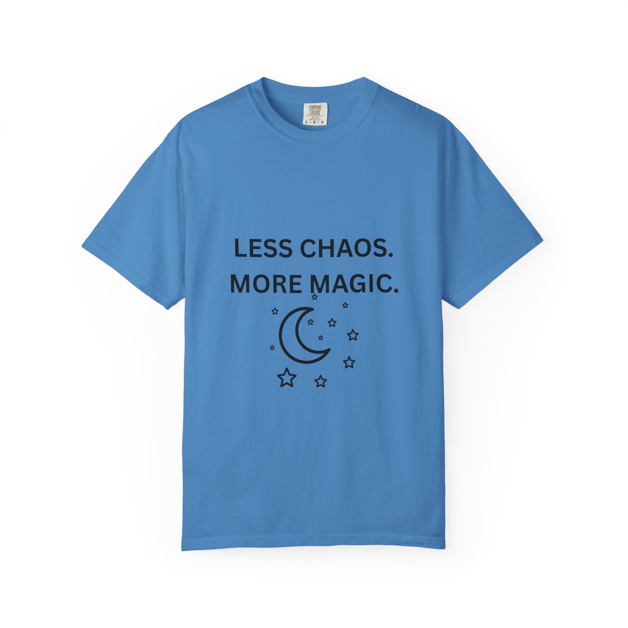 Medium blue graphic t-shirt with 'LESS CHAOS. MORE MAGIC.' and crescent moon stars print