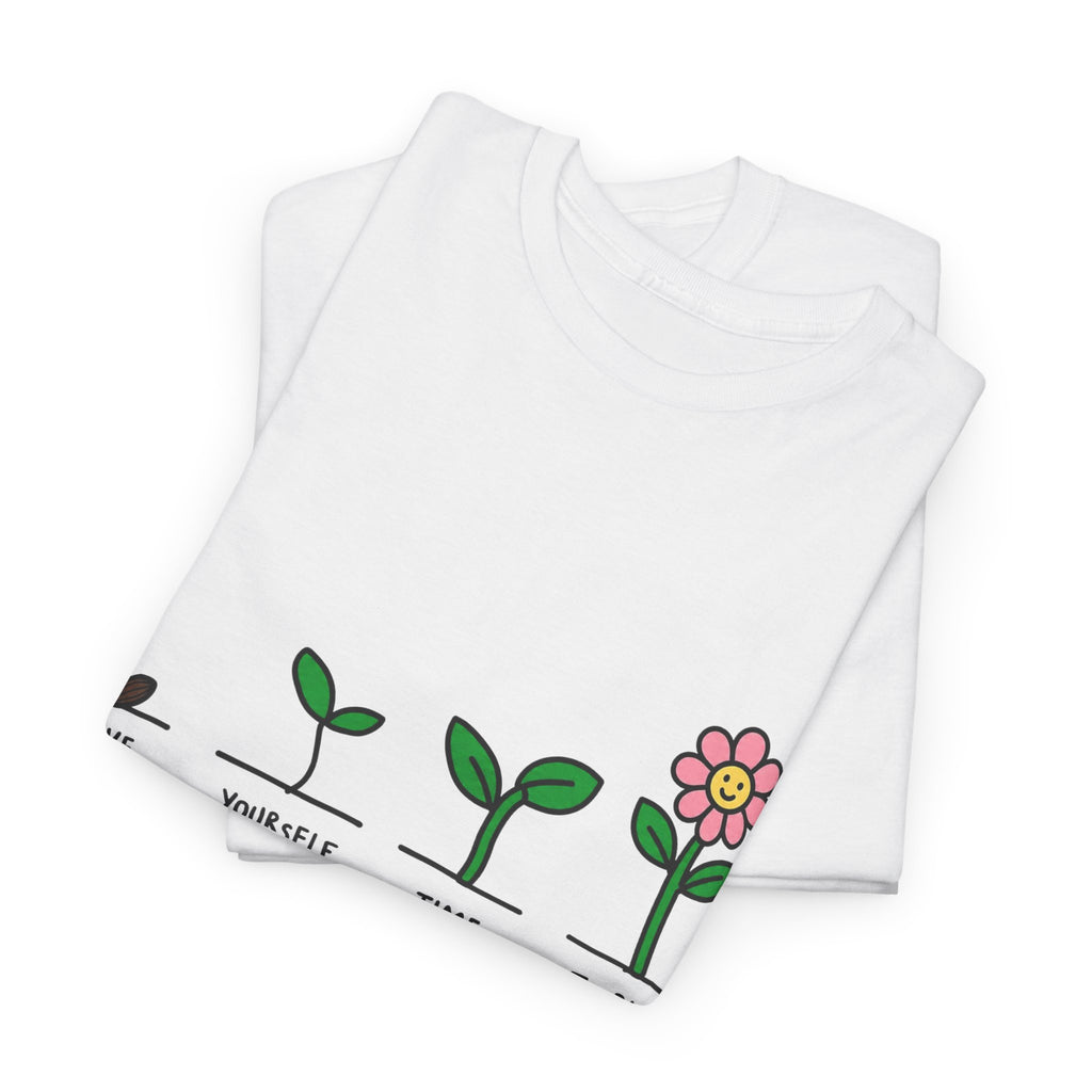White graphic t-shirt with green plant growth line and pink flower print on front