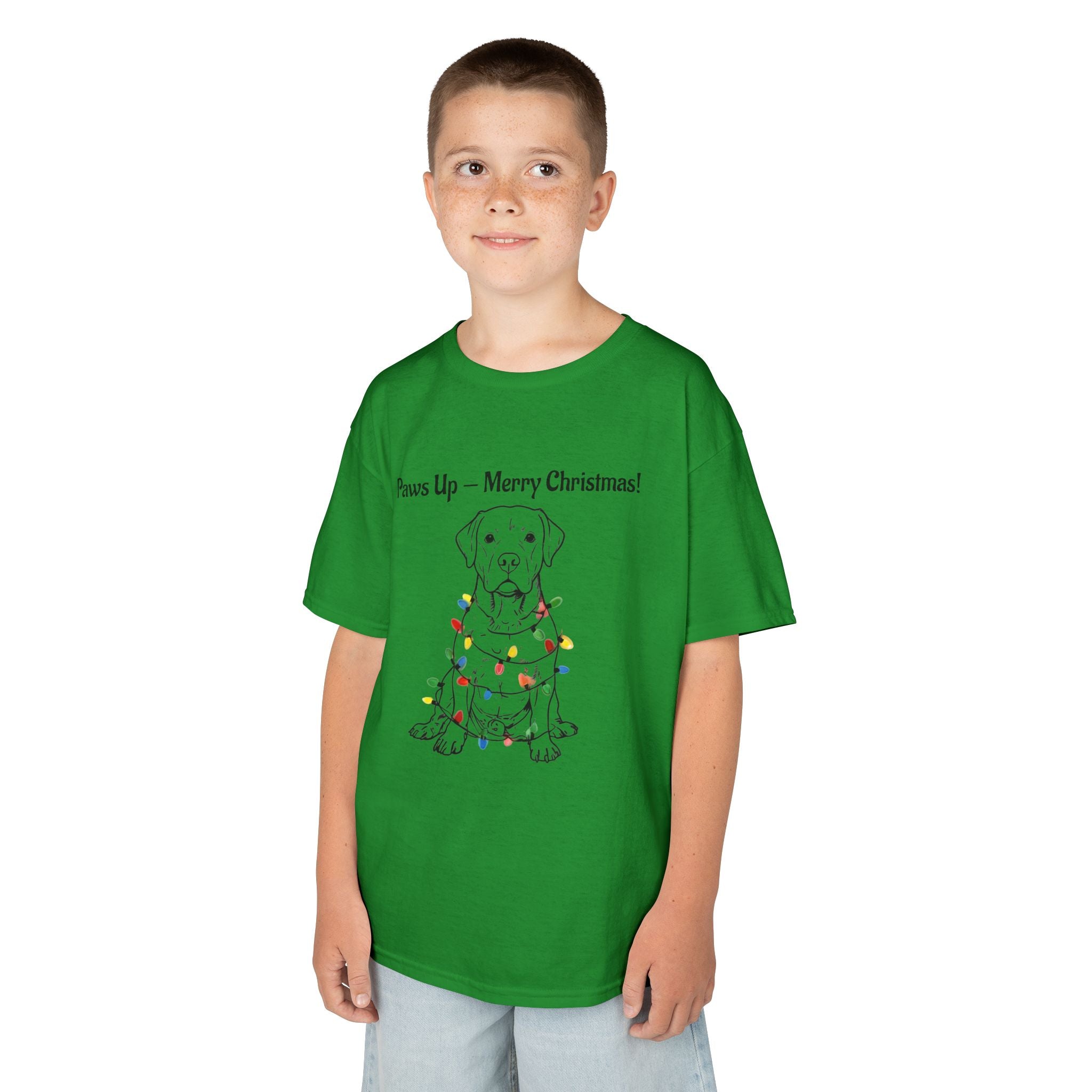 Kids green tee on child model, dog in Christmas lights graphic at center.