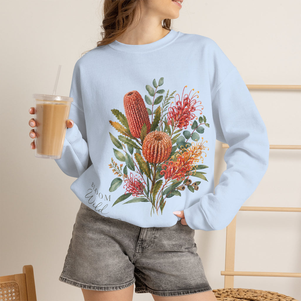 Light blue crewneck sweatshirt featuring colorful floral cactus graphic