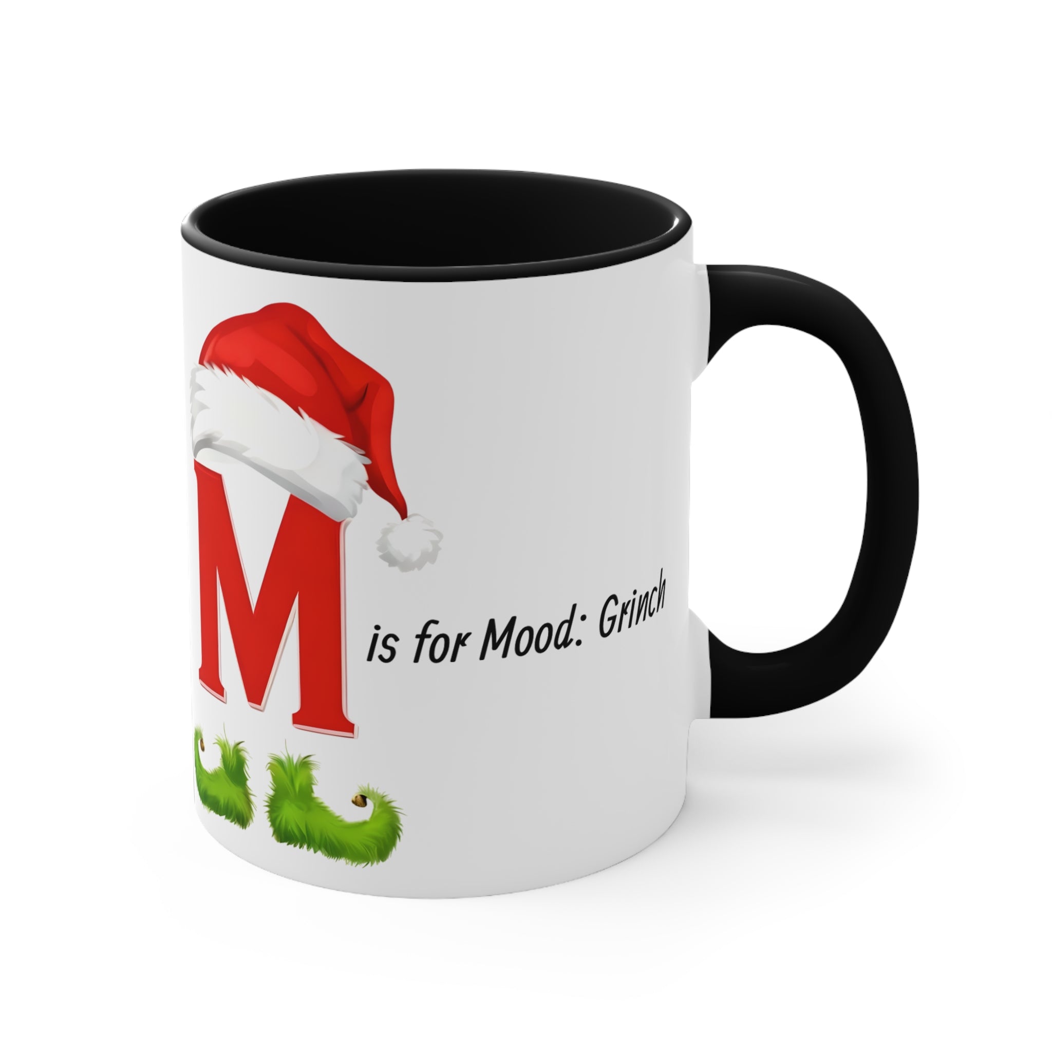 White ceramic letter M mug with black interior and handle; red Santa hat holiday graphic