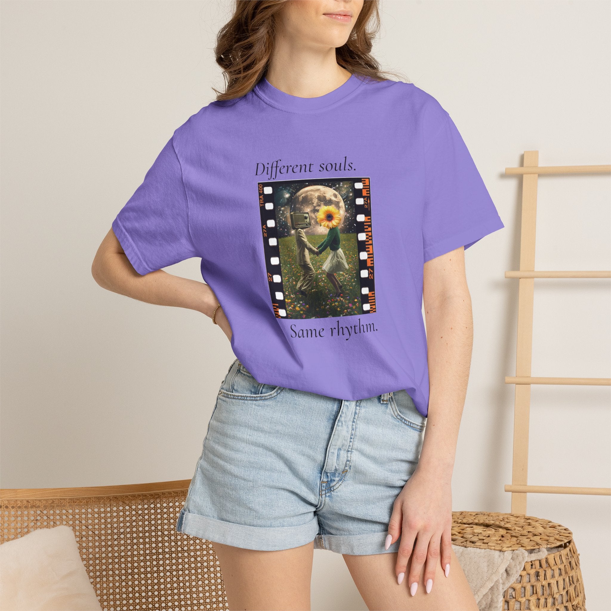 Purple crewneck graphic tee on model, movie-frame artwork with flower
