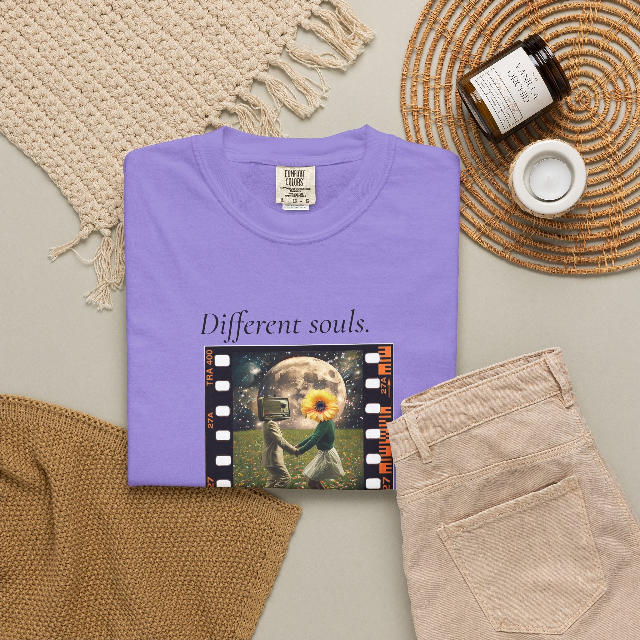 Purple crewneck graphic t-shirt with movie-frame art featuring flower and dancer