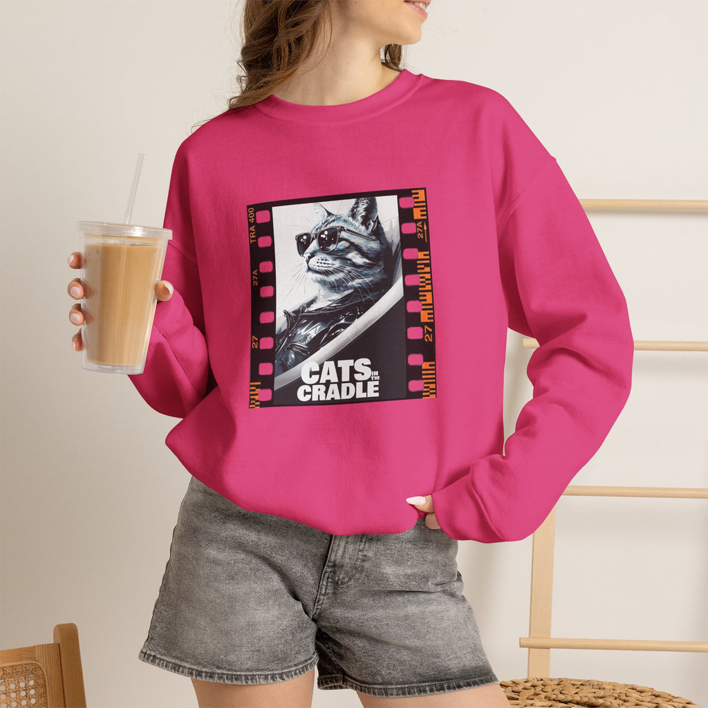 Pink crewneck sweatshirt with cat portrait graphic on chest, long sleeves