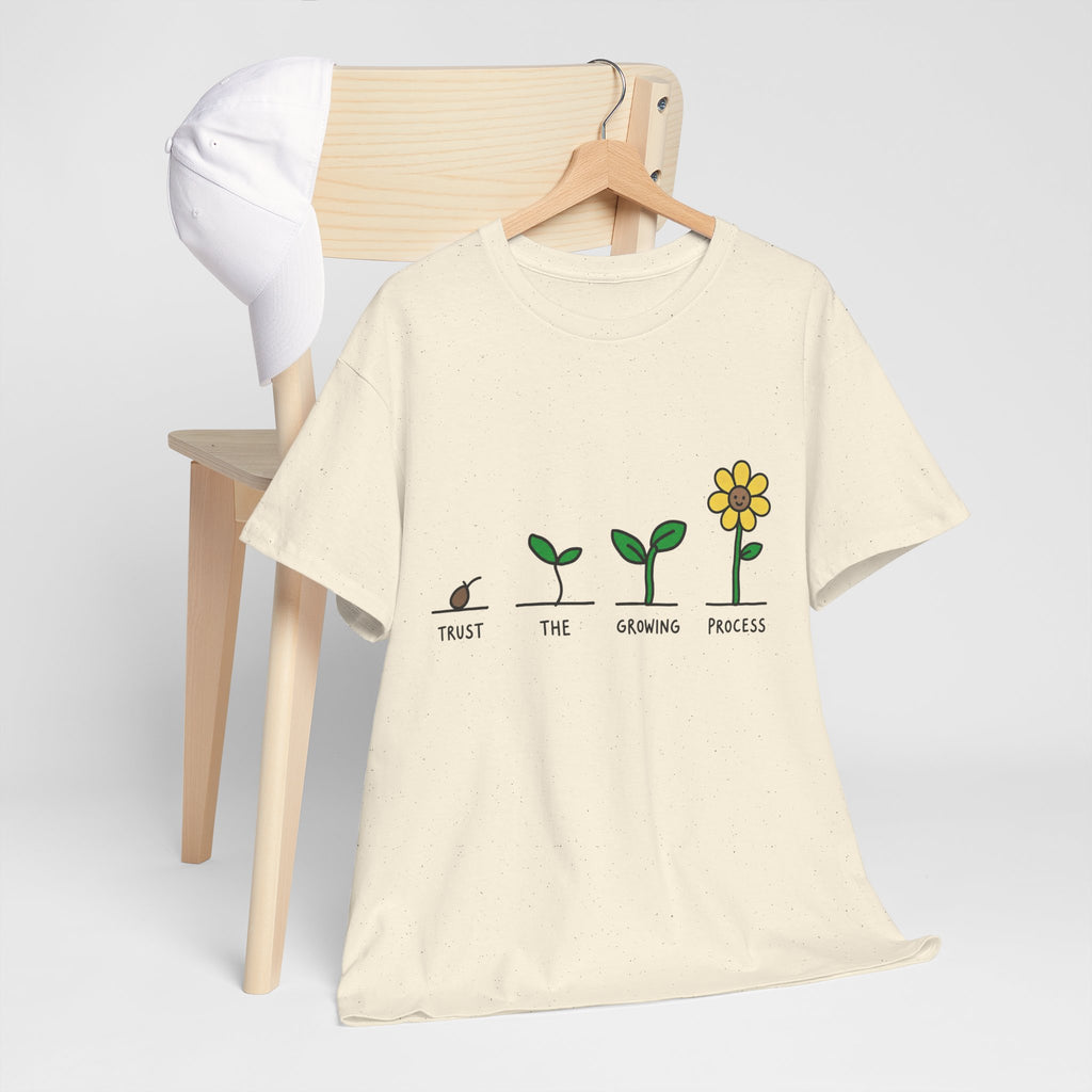 Natural/off-white crewneck T-shirt with green seedling-to-flower graphic and yellow blossom