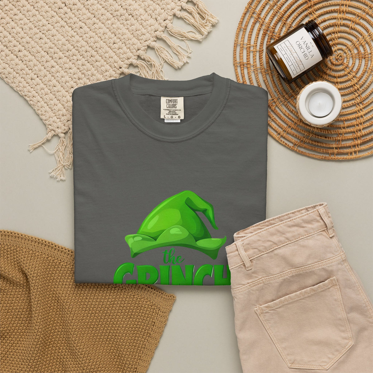 Graphite unisex T-shirt flat lay with green 'Grinch made me do it' print