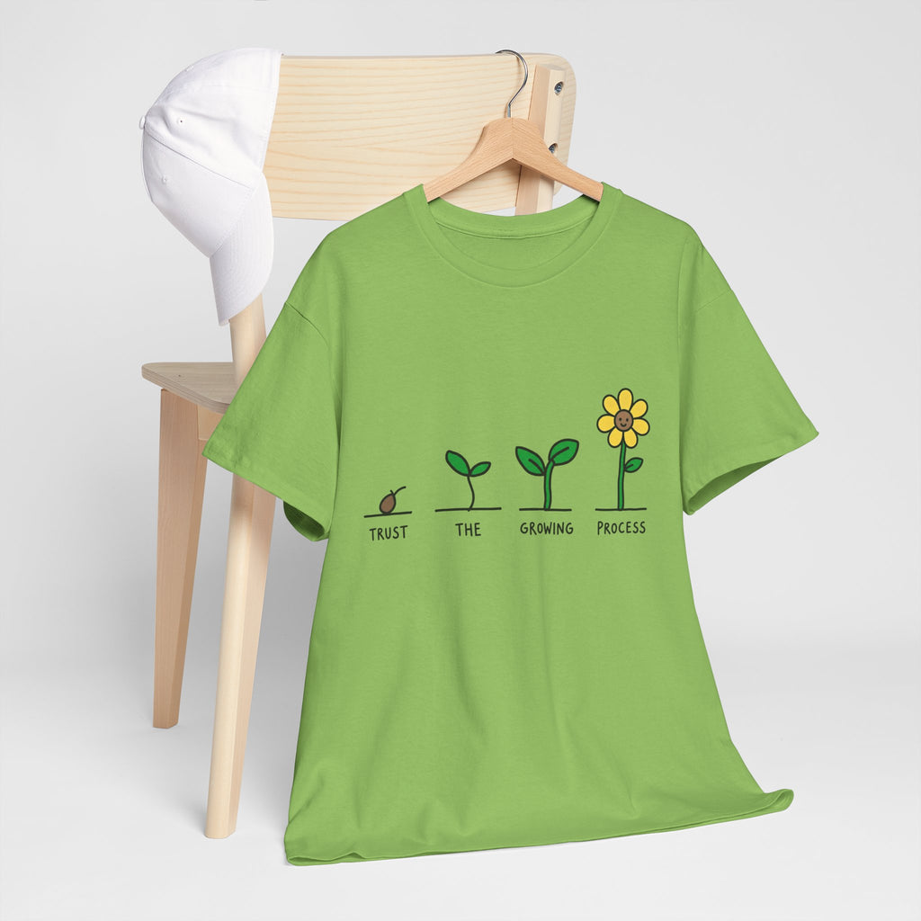 Green T-shirt with sprout-to-flower graphic and message text across the chest