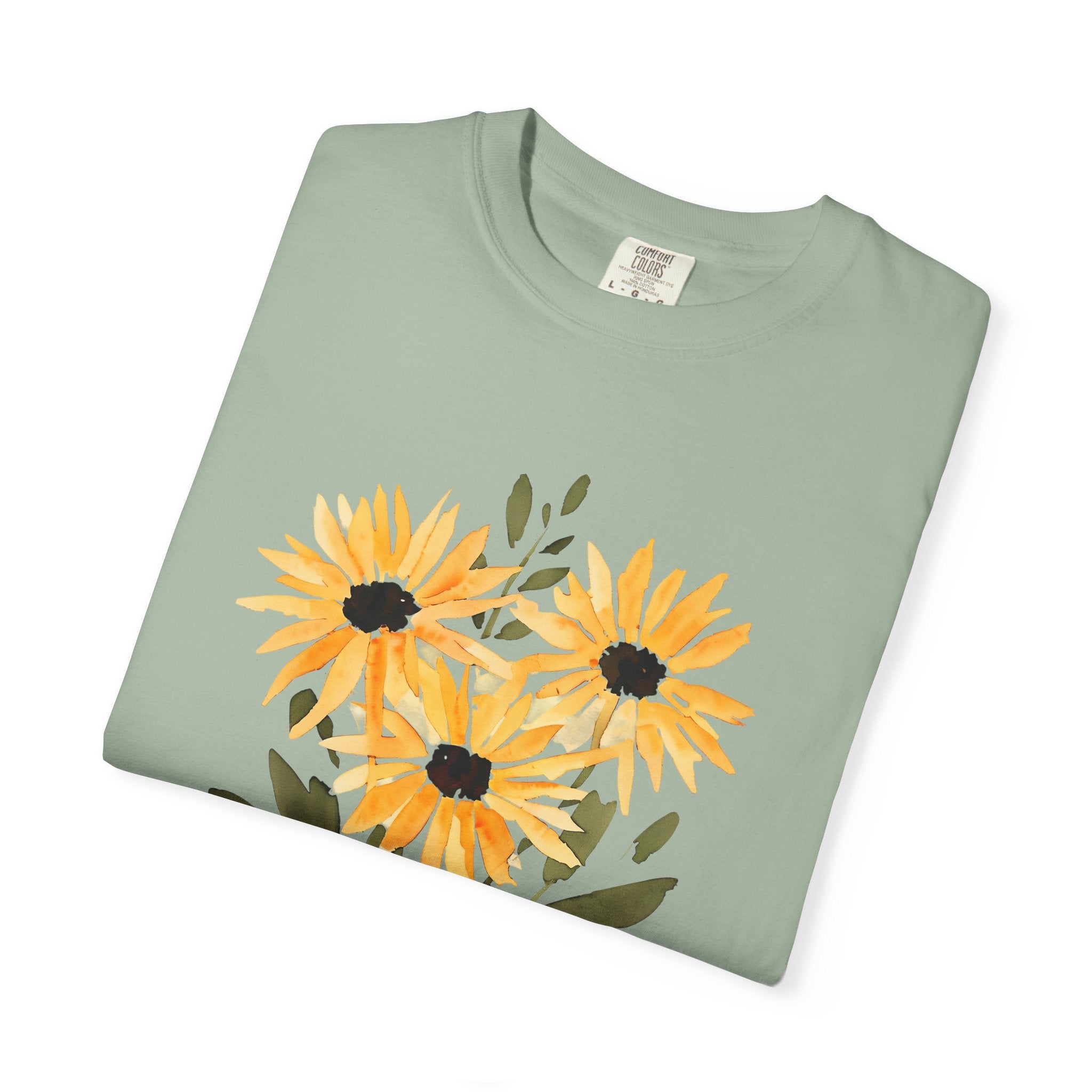 Light green t-shirt, close-up view of sunflower bouquet print and crew neckline