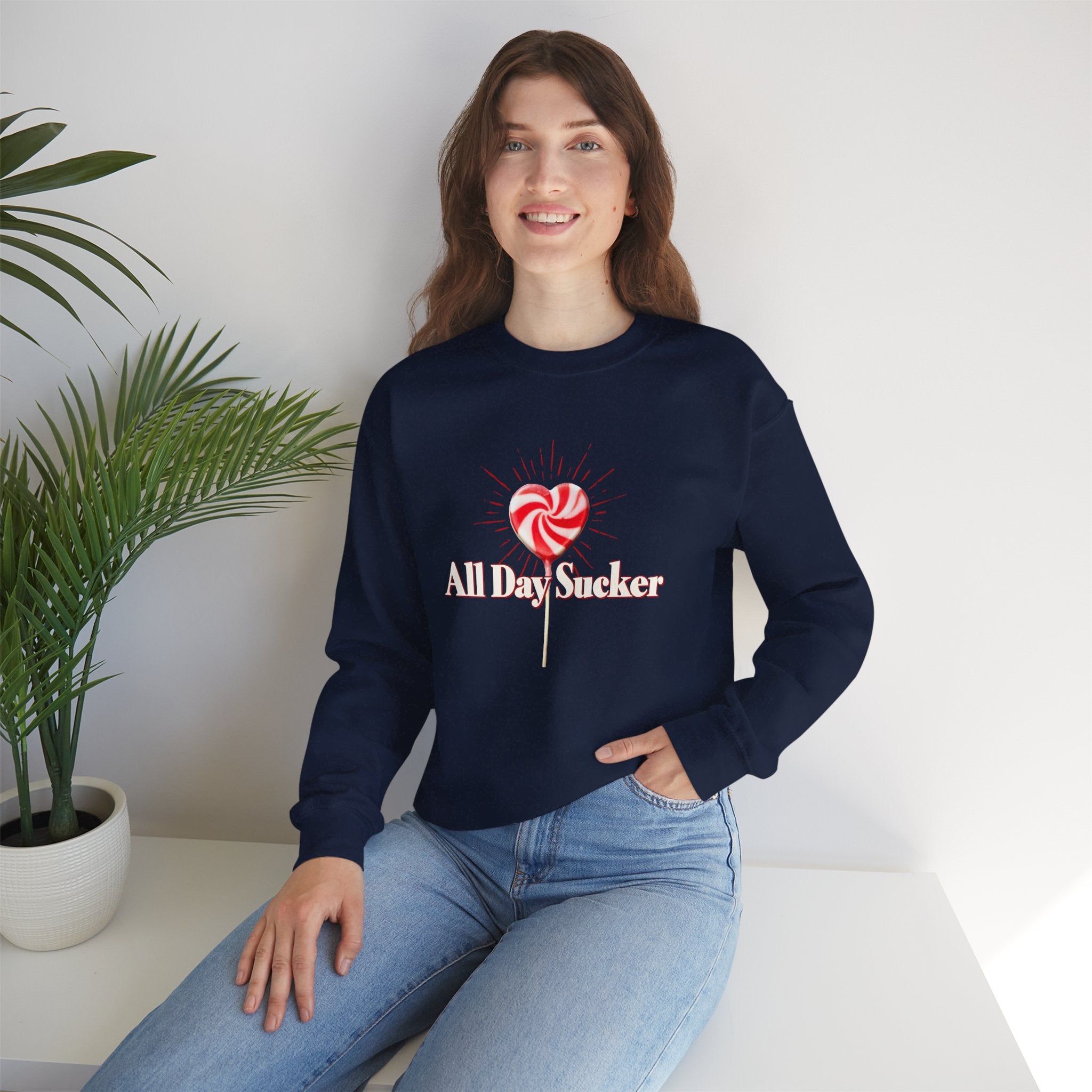 Navy graphic lollipop heart sweatshirt on model with red and white candy print