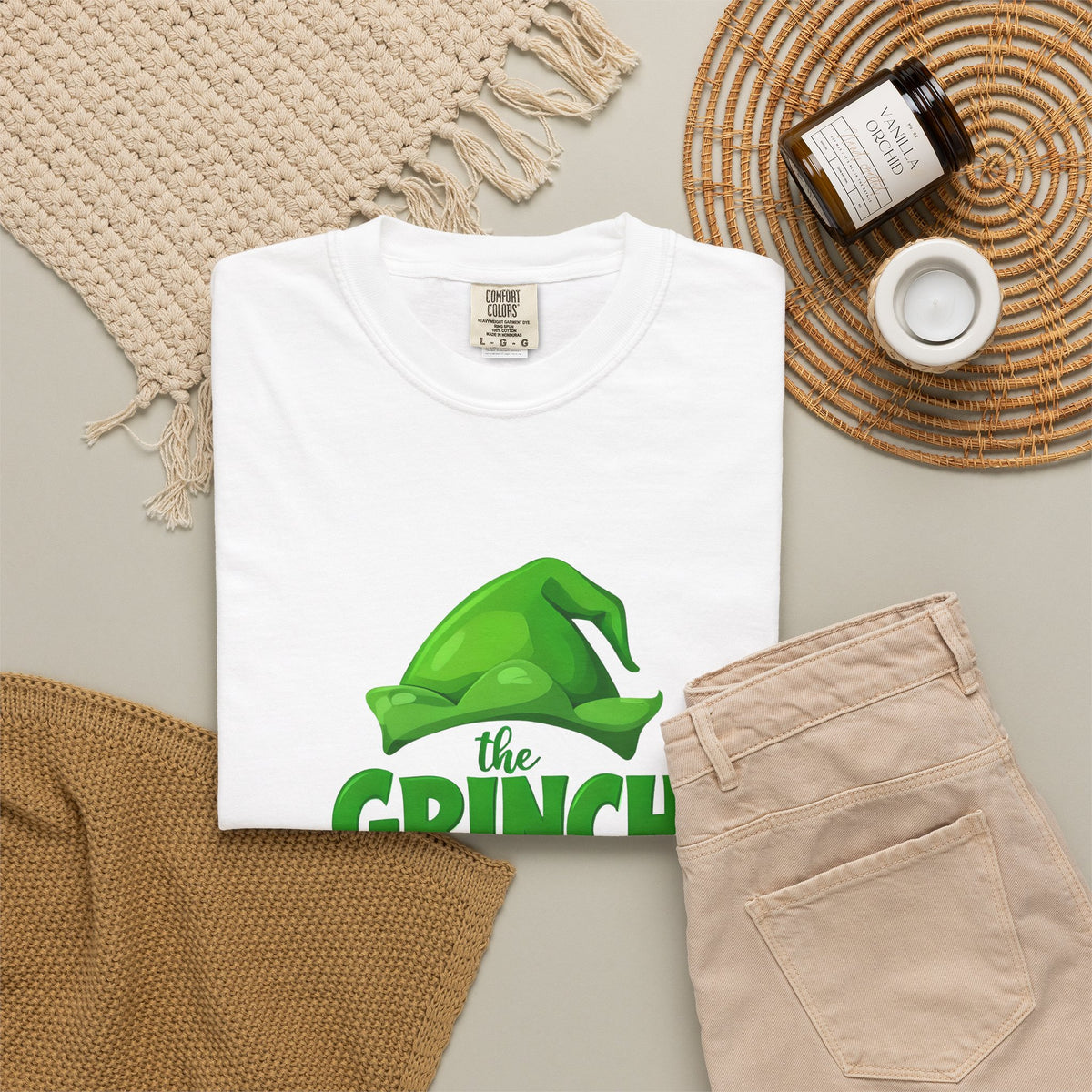 White unisex graphic T-shirt with green Grinch “the GRINCH made me do it” print