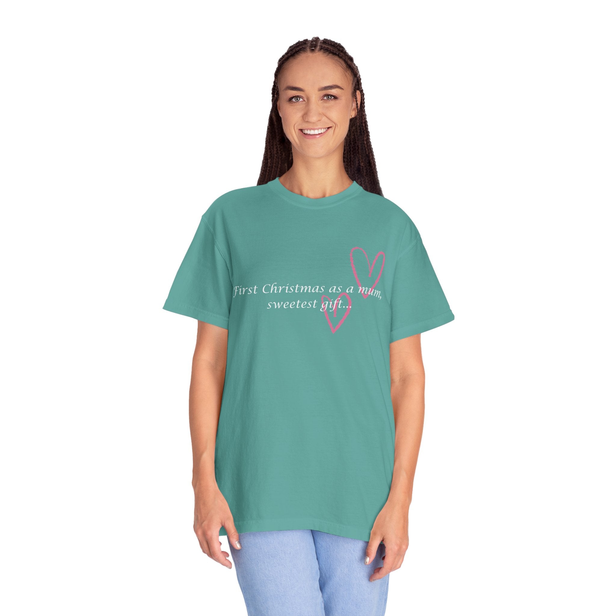Teal crewneck T-shirt on model with pink heart graphic and 'First Christmas as a mum' text