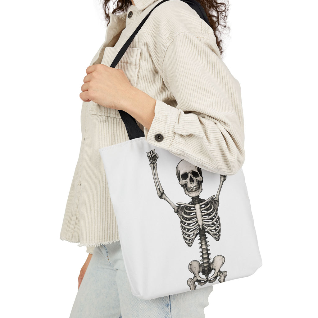 White canvas tote bag with black handles, featuring a skeleton hands-up graphic.