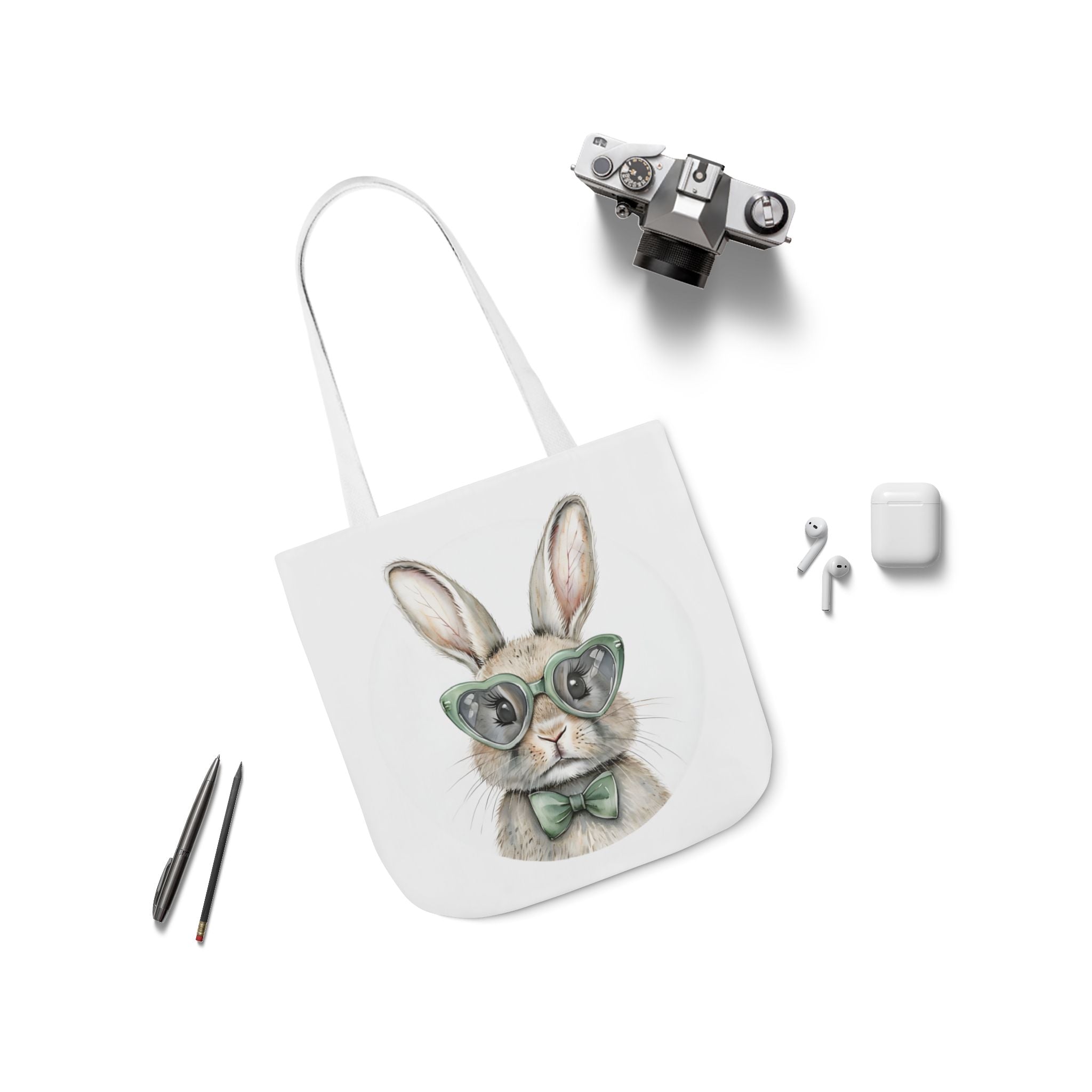 White canvas tote bag with bunny portrait wearing green glasses and bow, with long handle