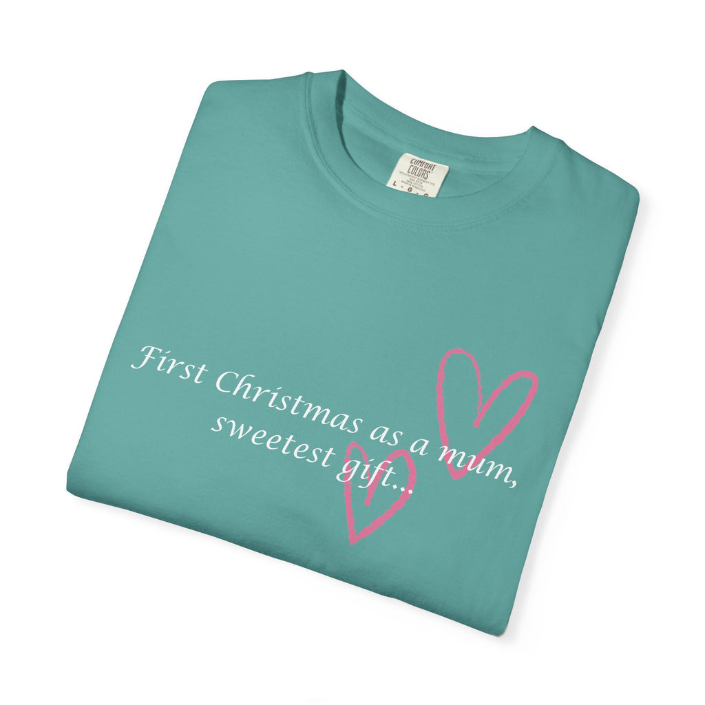Teal crewneck T-shirt folded with pink heart graphic and 'First Christmas as a mum' text