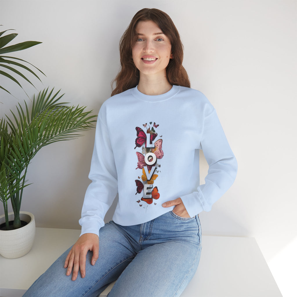 Light blue crewneck sweatshirt worn by model, with butterfly LOVE graphic front
