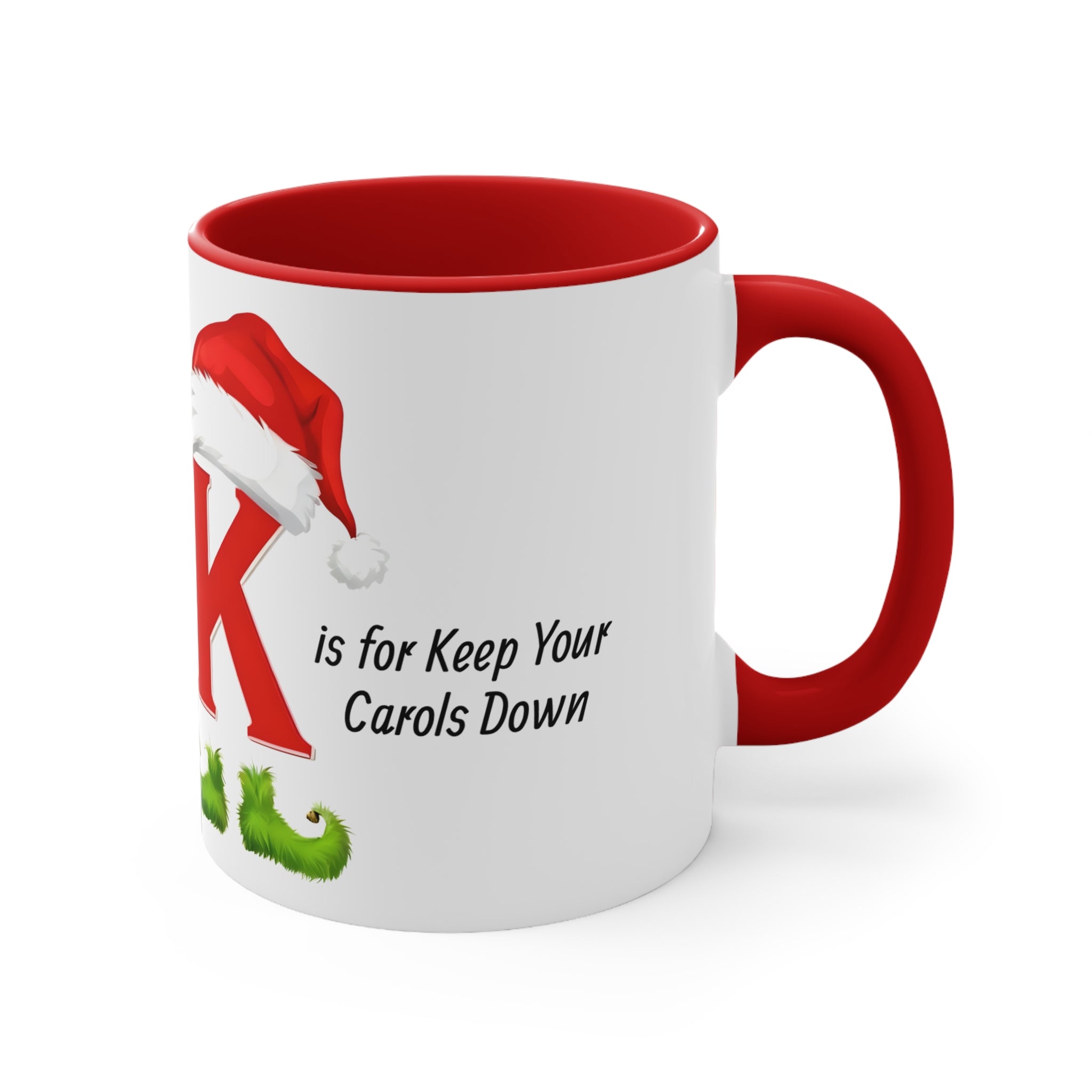 White mug with red handle, K letter and Keep Your Carols Down holiday text.