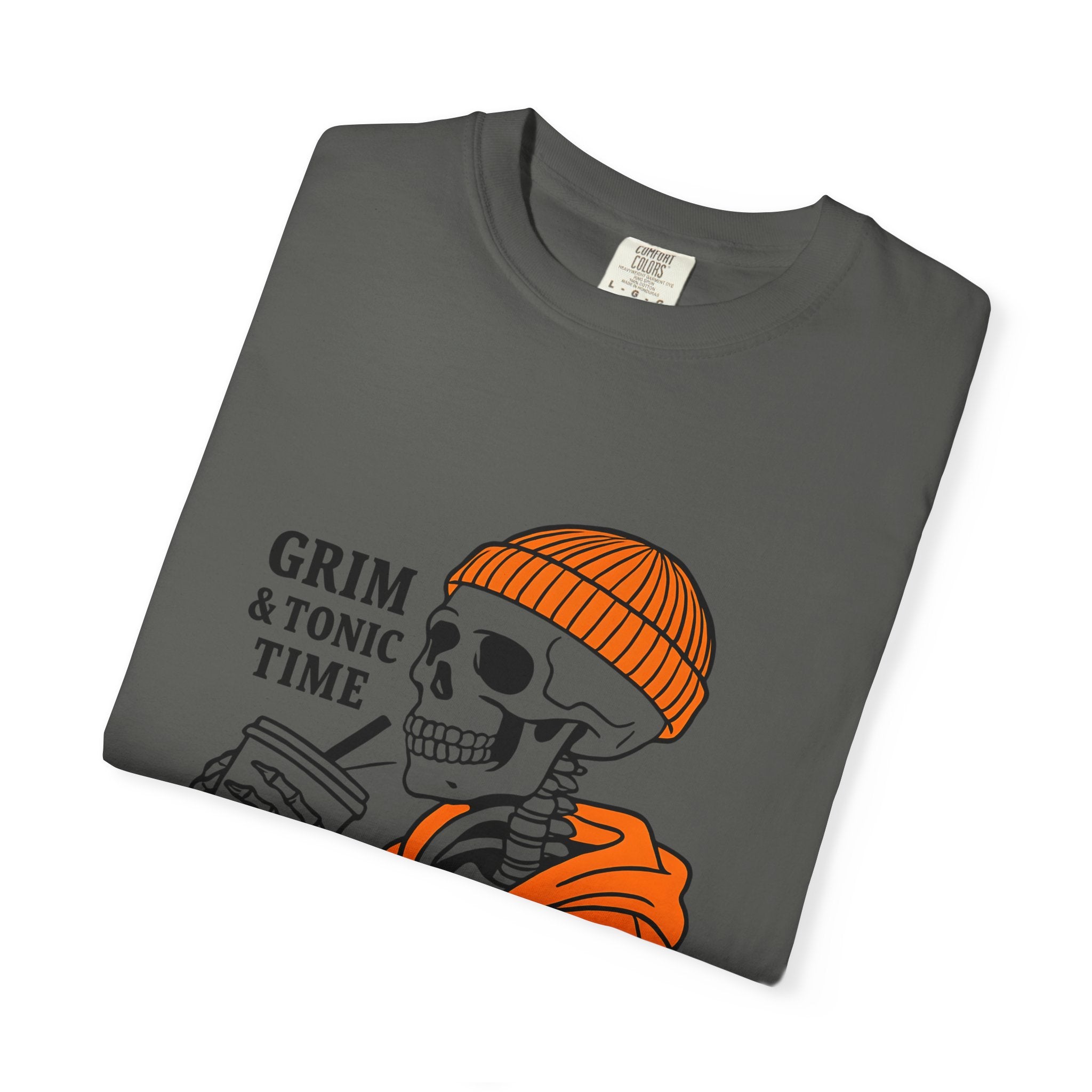 Dark gray graphic tee with Grim & Tonic Time skull, orange beanie, and orange jacket