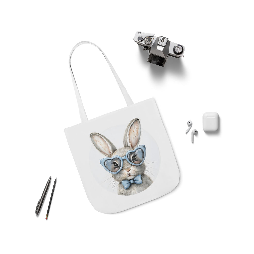 Bunny canvas tote bag with rabbit face graphic, white straps laid flat
