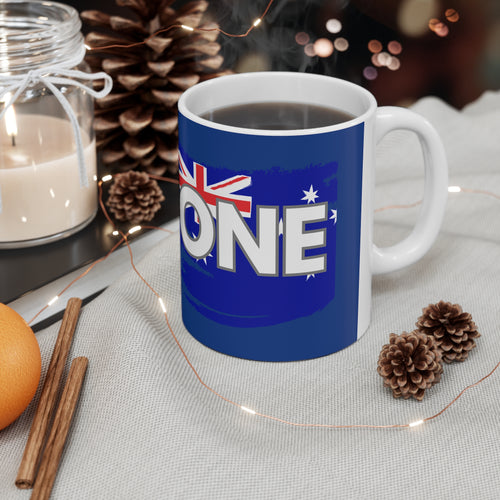 Blue ceramic coffee mug with white handle and 'ONE' Australia flag map graphic