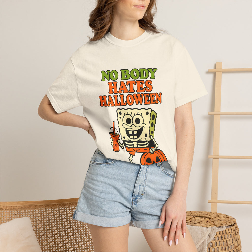Ivory sponge graphic T-shirt with “NO BODY HATES HALLOWEEN” text worn with denim shorts