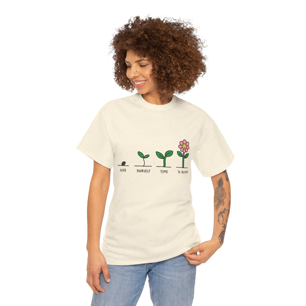 White graphic t-shirt with small green plant growth line and pink flower icon print