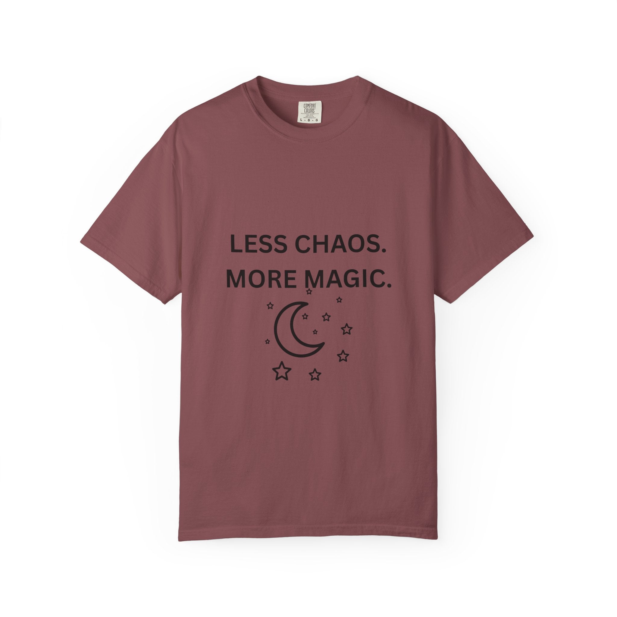 Burgundy graphic t-shirt with 'LESS CHAOS. MORE MAGIC.' and crescent moon stars print
