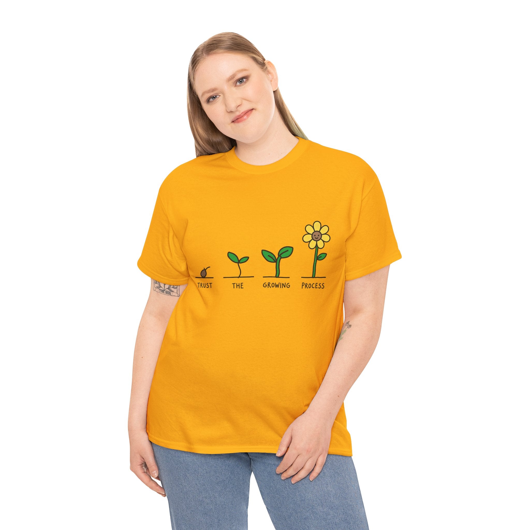 Gold crew-neck T-shirt worn by model with seedling-to-flower graphic