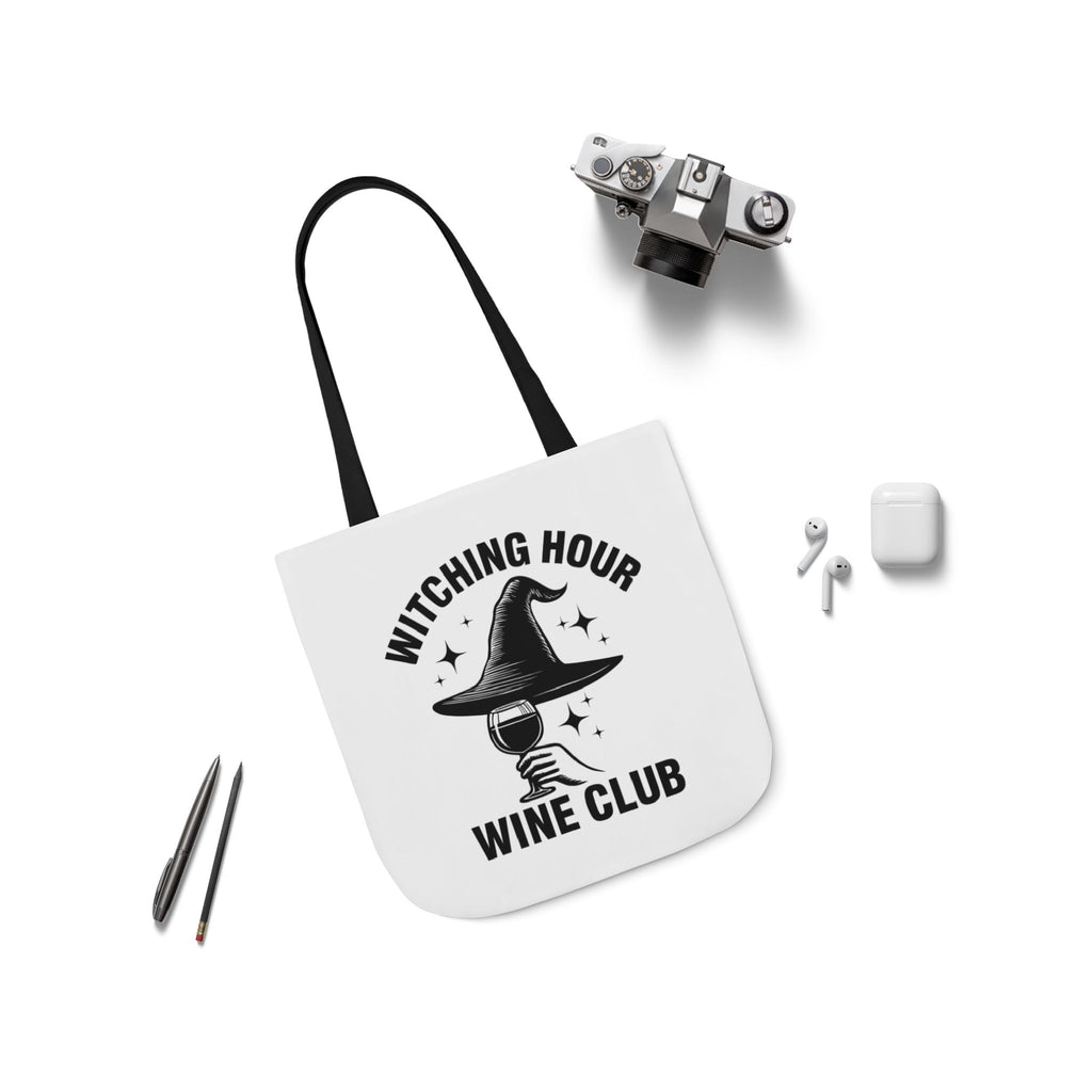 White canvas tote bag with black handles, witch hat and wine club text graphic.