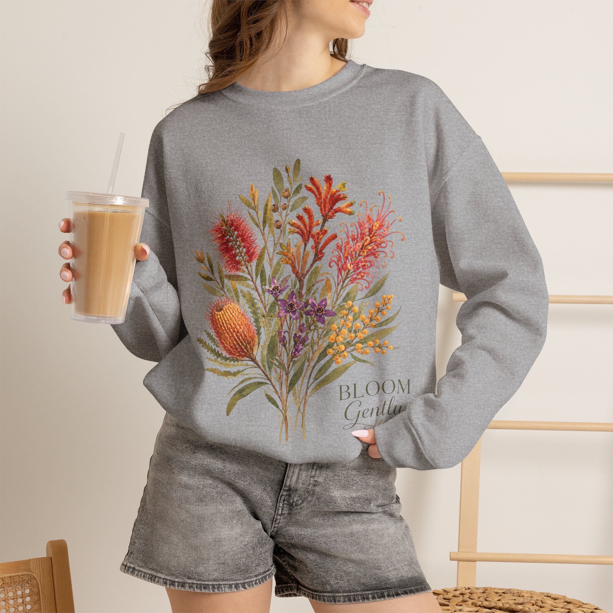 Sport grey crewneck sweatshirt with floral bouquet print and text "Bloom Gently"
