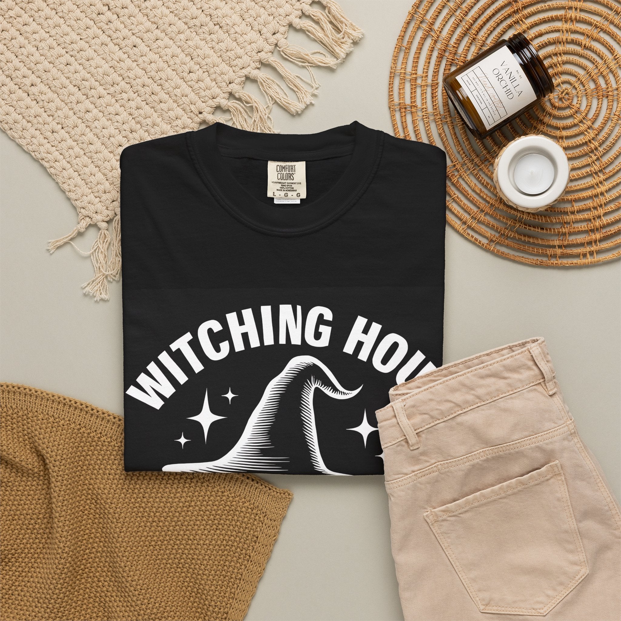 Black crew-neck T-shirt with witch-hat wine club logo on the front