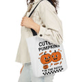 Canvas Halloween tote bag with black handles and cute pumpkin print: 'CUTEST PUMPKINS'.
