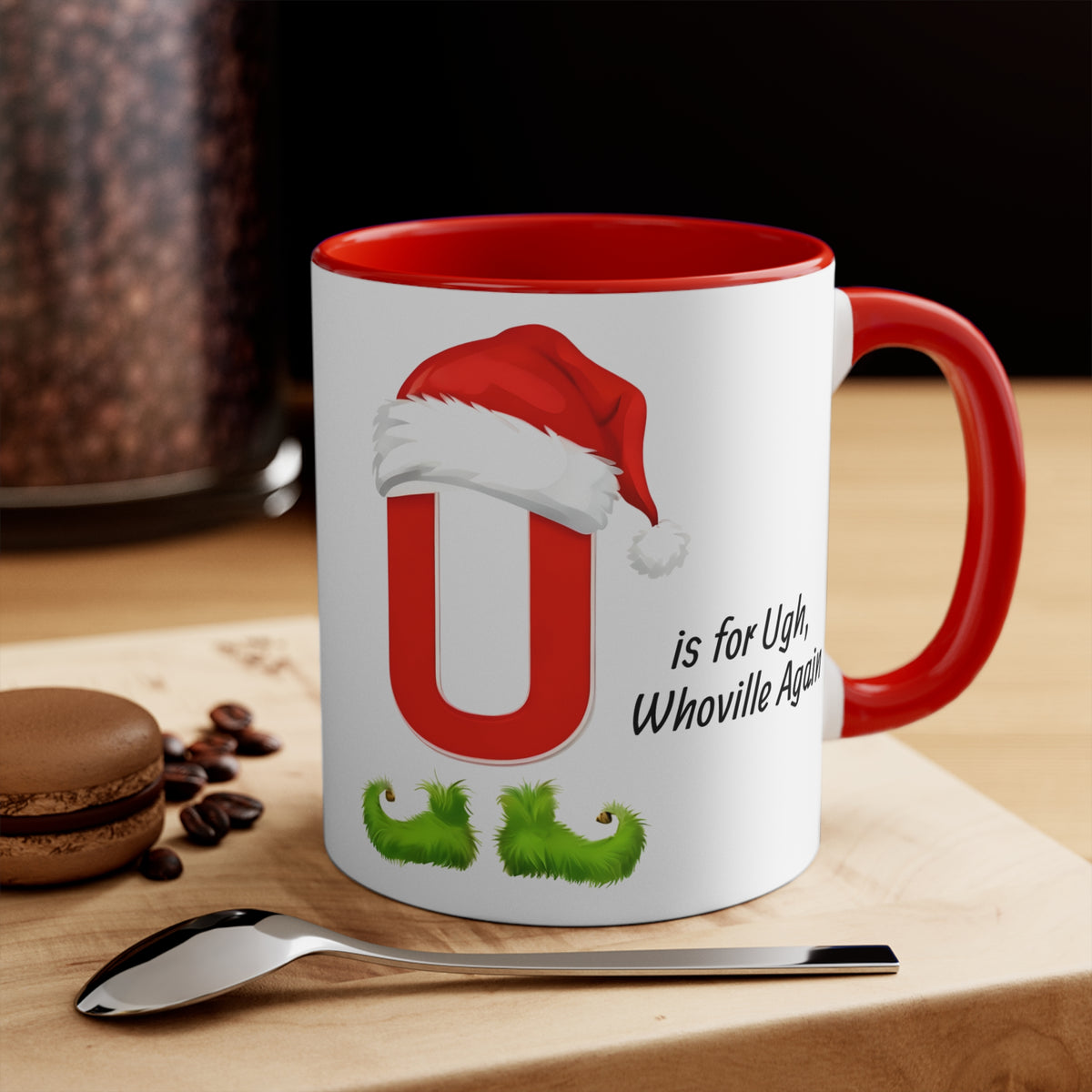 White mug with red handle and rim; red U with Santa hat; "is for Ugh, Whoville Again"