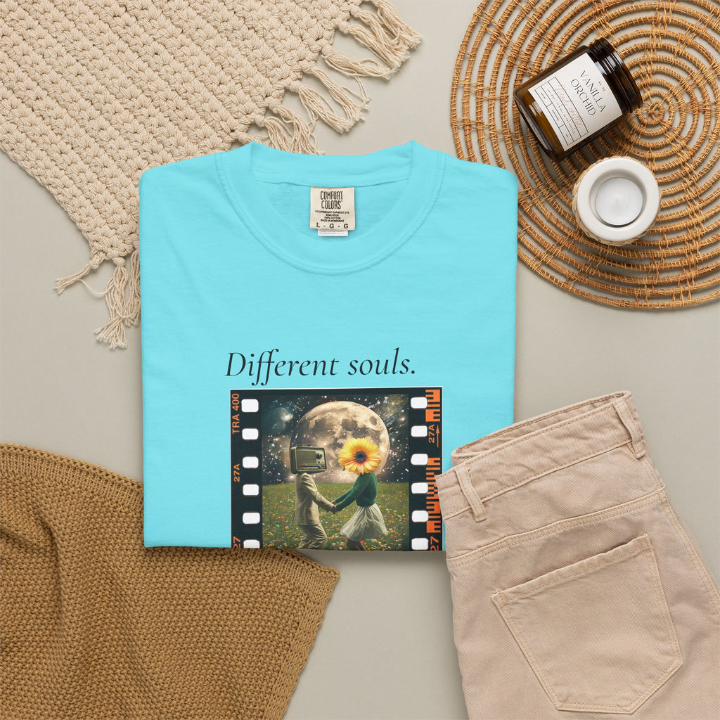 Light blue crewneck T-shirt with sunflower filmstrip graphic and “Different souls” and “Same rhythm”.