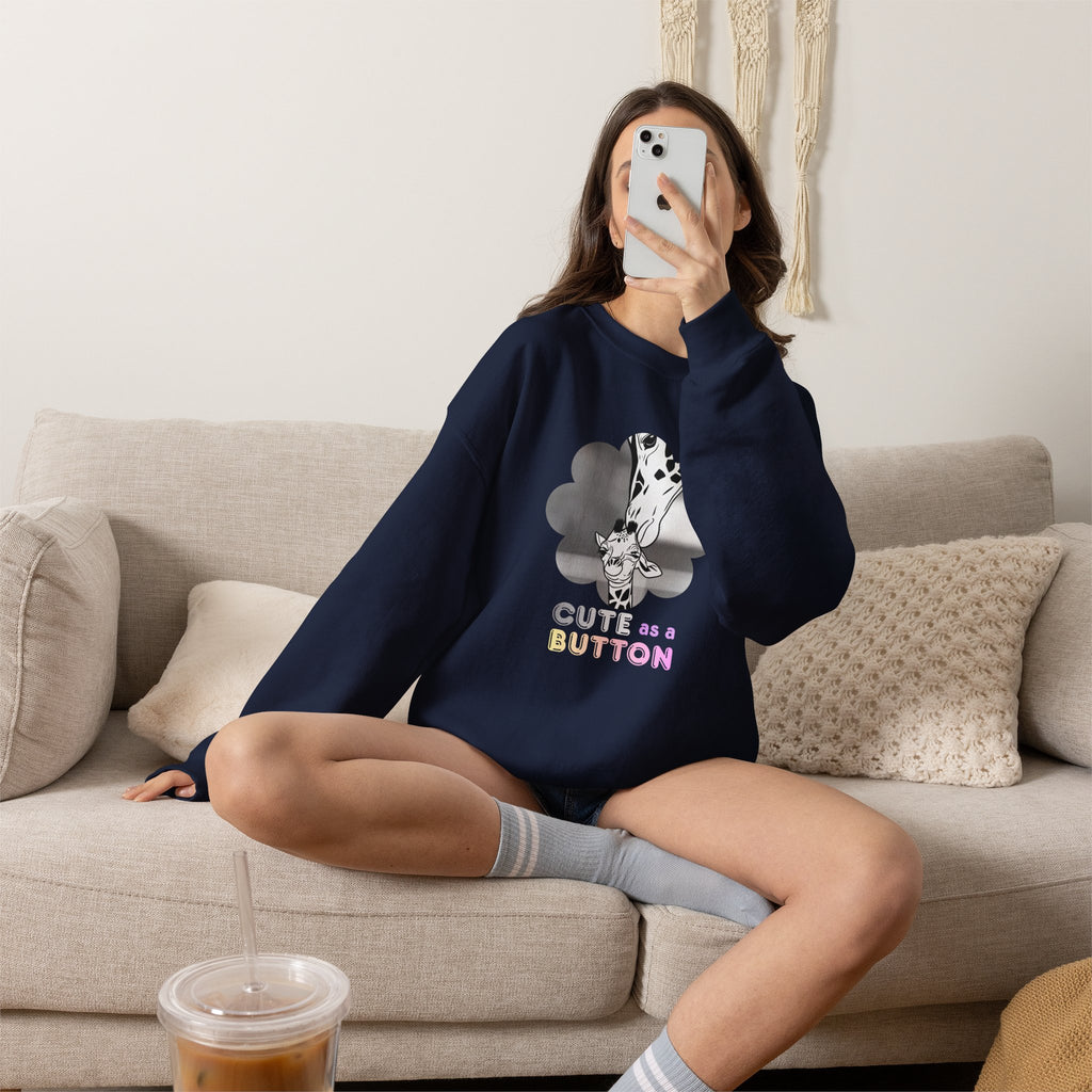 Navy crewneck sweatshirt with giraffe in flowers graphic and "CUTE as a BUTTON" text