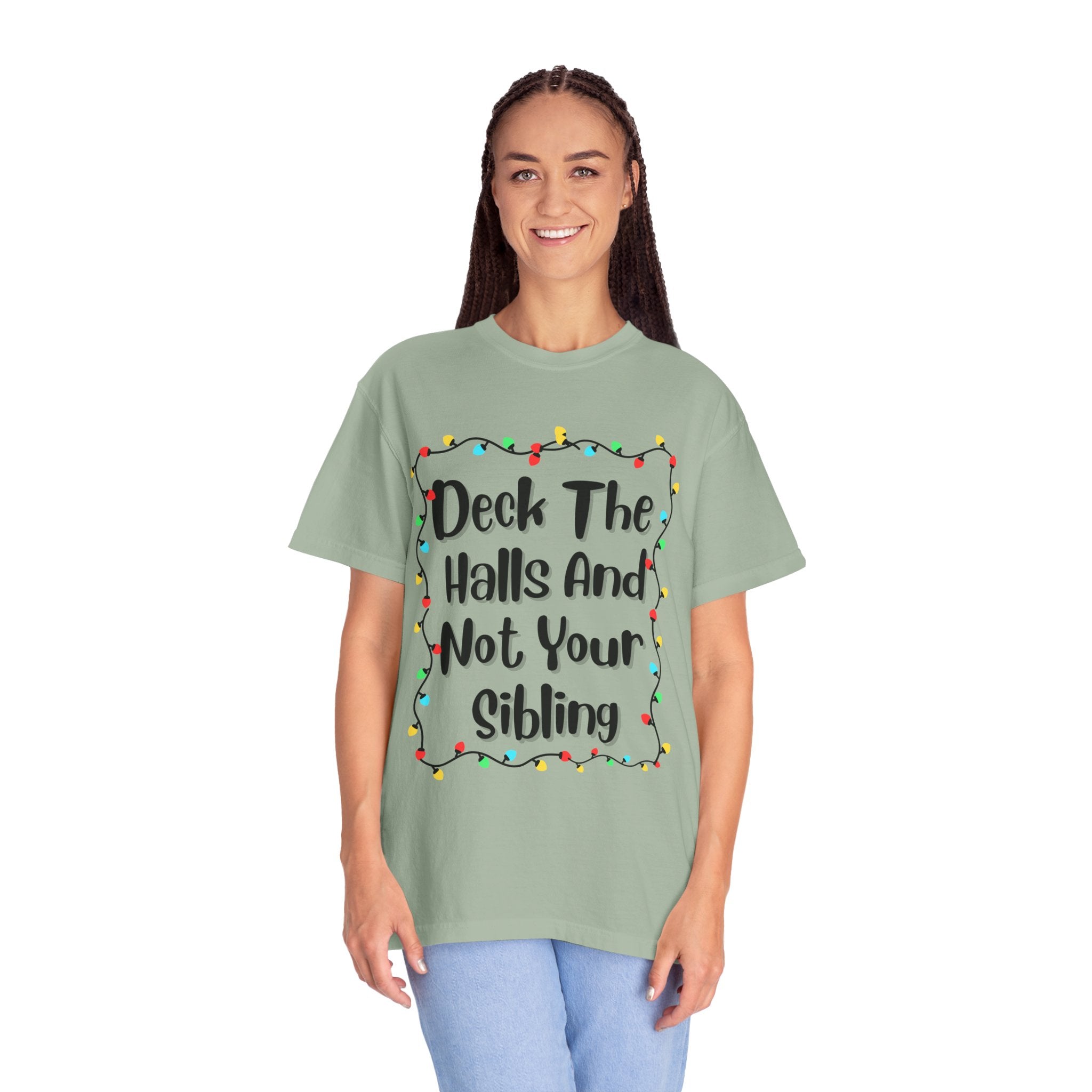 Green crewneck T-shirt on model with colorful holiday lights slogan print